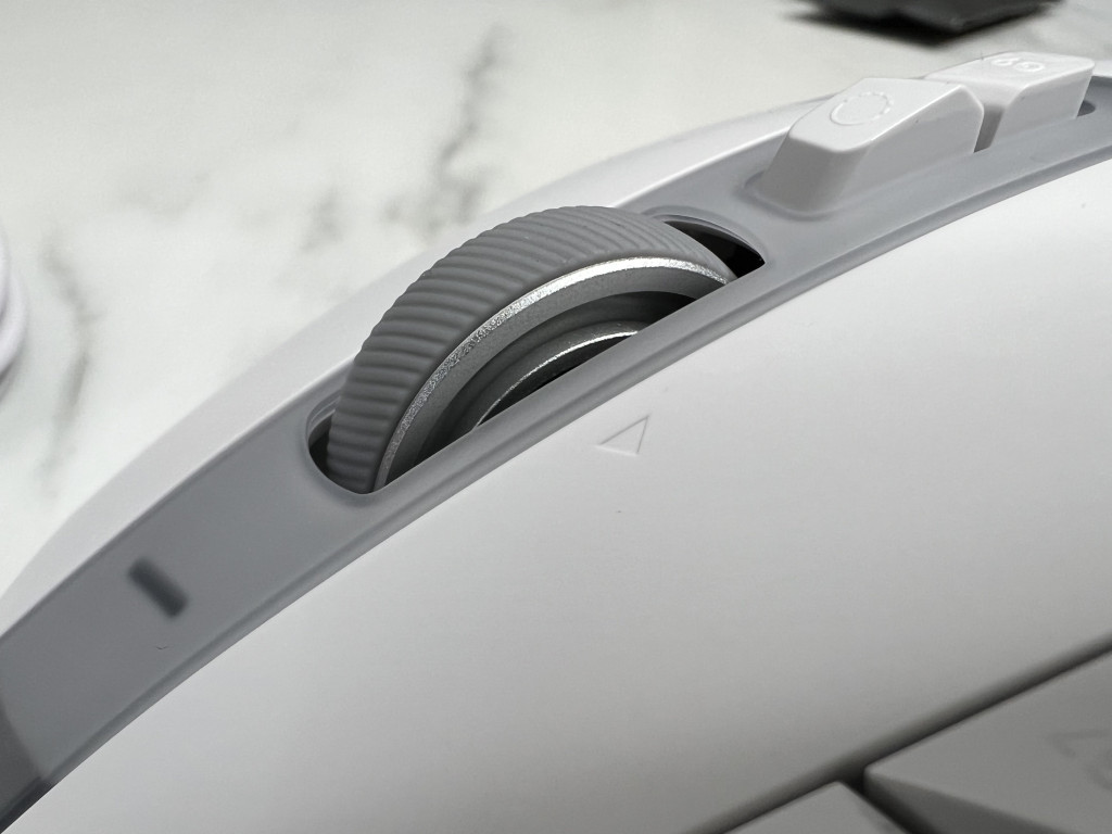 Close up of the Logitech G502 X mouse showing the scroll wheel.