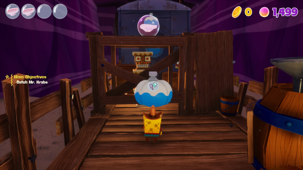 screenshot showing SpongeBob in a wild west costume navigating the carriages on an old train. Infront of him is a blue and white platform that needs to be interacted with to inflate it to jump on.