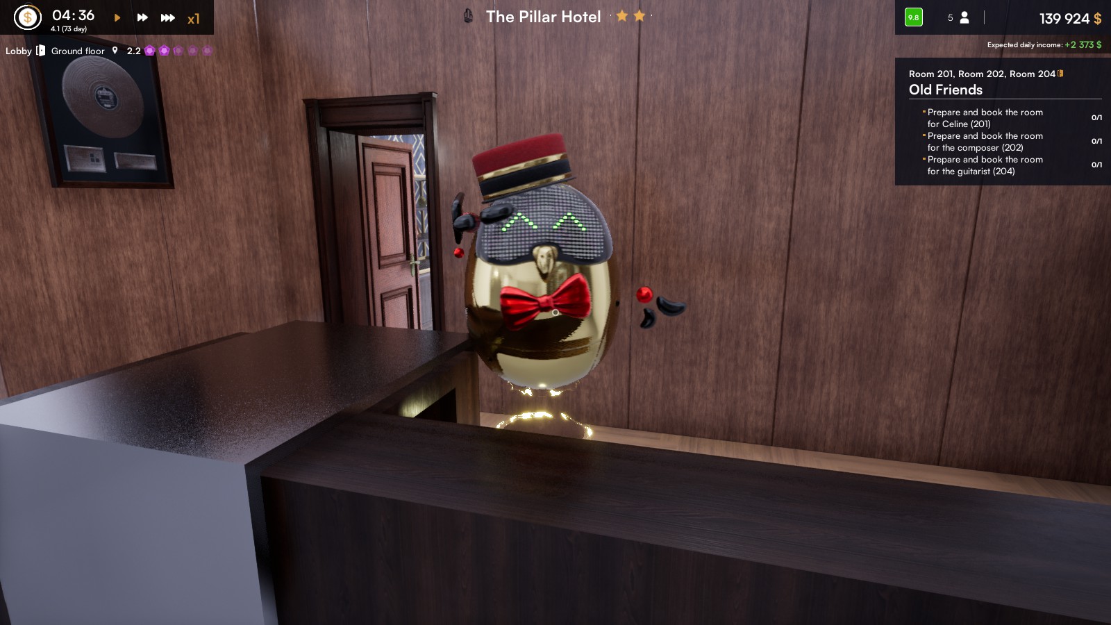 A saluting robot receptionist wearing a traditional bell boy hat, is saluting you as you pass by. Desk is black with a silver corner and a rare vinyl hangs a brown wooden wall.
