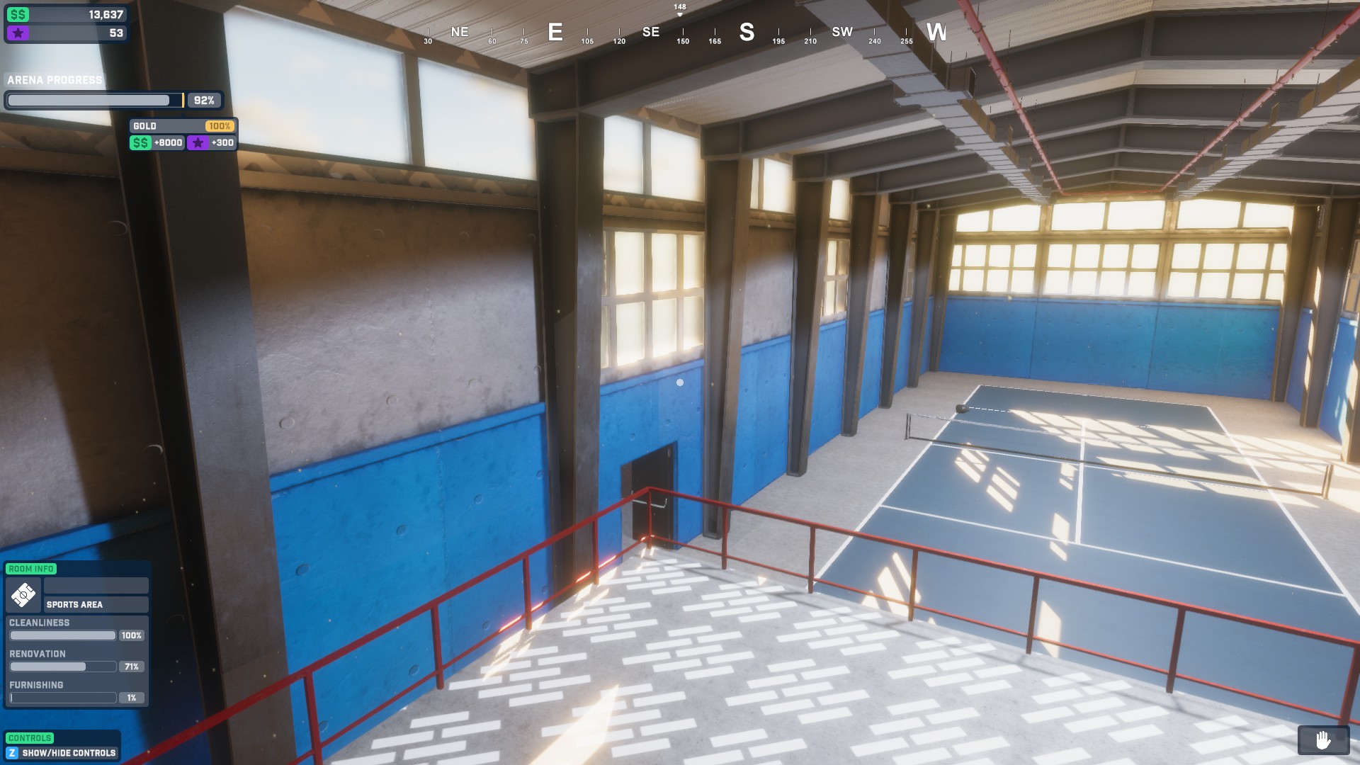 A large room with concrete walls and blue paint, a blue tennis court is shown near the lower area. tile symbols hightlight the area I need to place flooring.