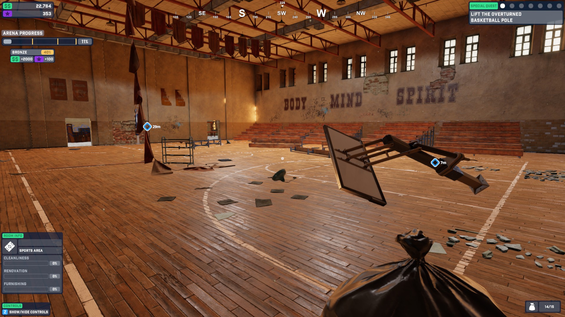 A basketball court filled with rubbish, broken equipment and fallen flags. the player is holding a trash bag in their hands.