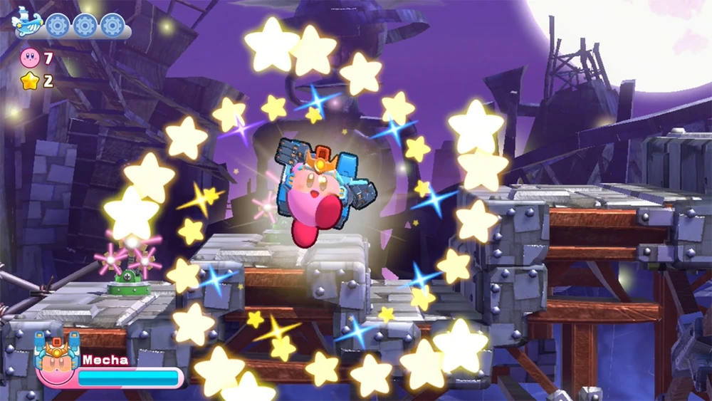 Kirby's wearing the new mech suit surrounded by stars in a ruin looking level.