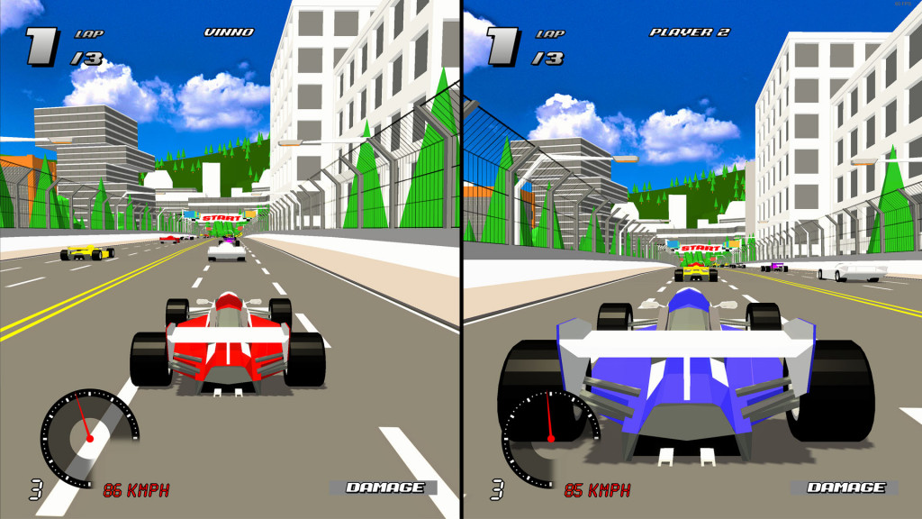 A screen showing the games split screen offering. On the laft is play 1 named "Vinno", in a red and white F1 style car. On the right is Player 2, named "Player 2" in a purple and white F1 style car. The track has metal fencing either side. On the right is trees, on the left is buildings.