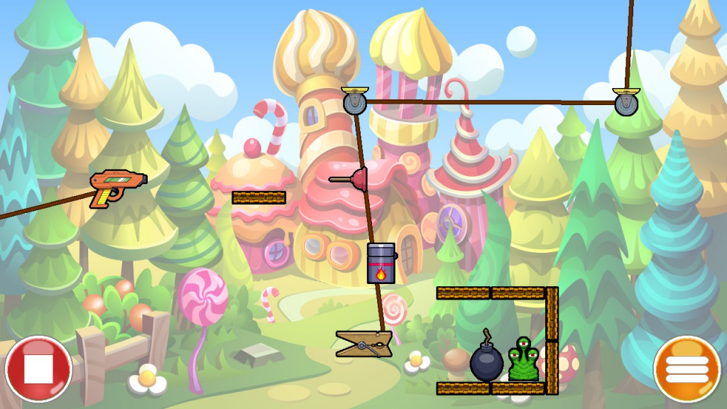 screenshot showing a puzzle level. a candy style castle is in the backdrop in pink and yellow, surrounded by green, yellow and blue trees. In the forefront are various cog, conveyor and pully attachments. An alien in sits on a platforms waiting to be destroyed by a bomb.