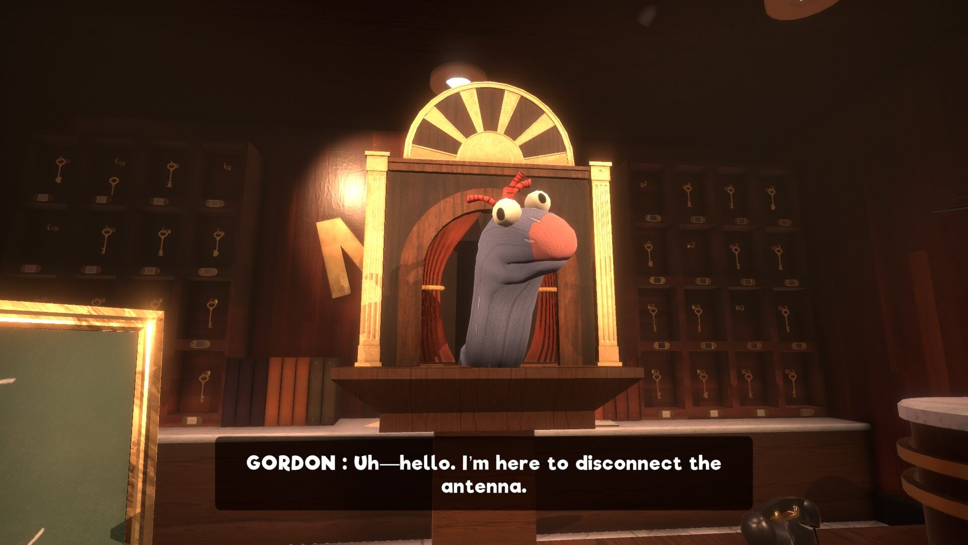 Ricky the sock puppet is protruding from a small stage. The subtitles belong to the main hero Gordon the handyman.