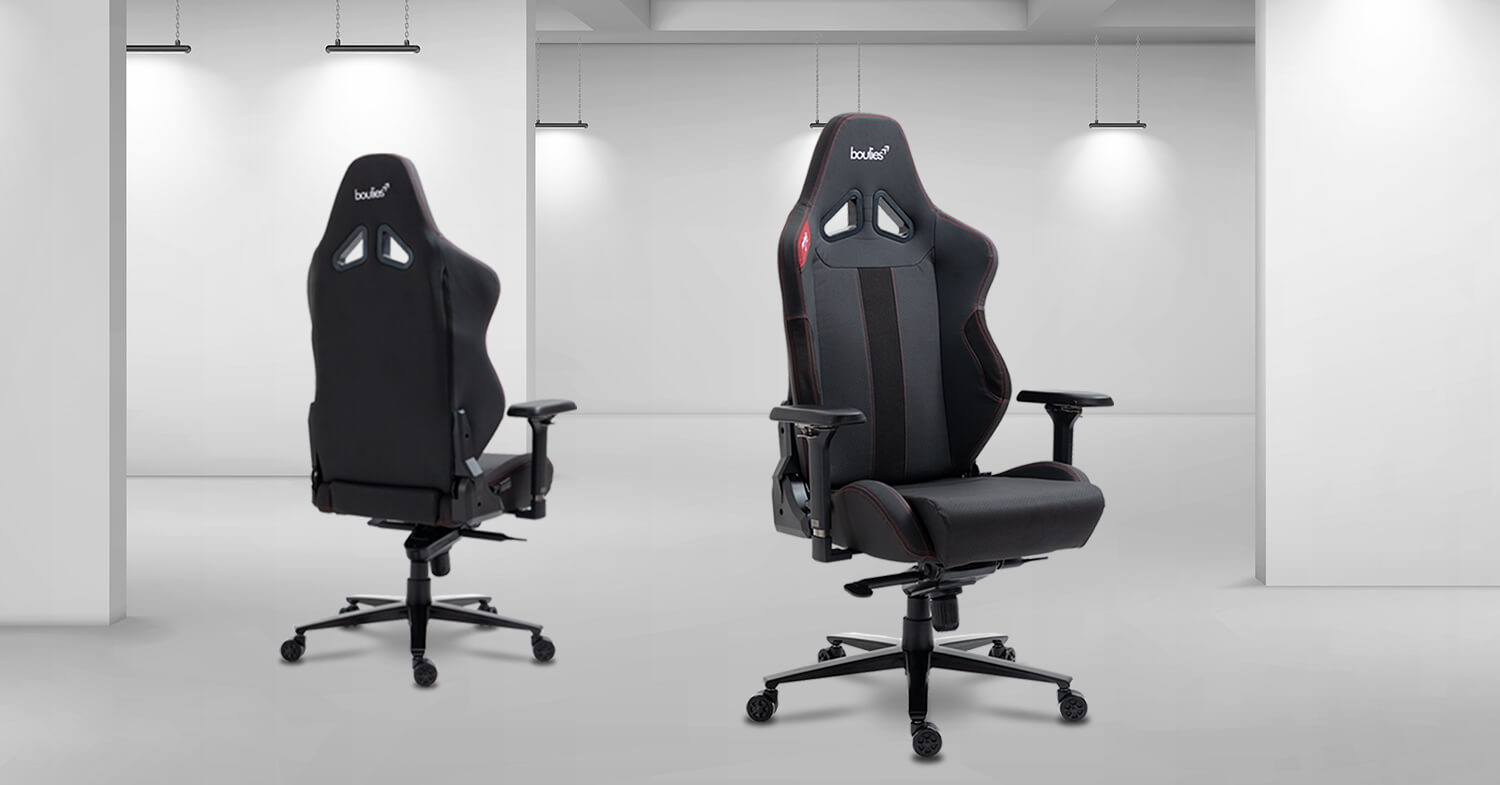 The Ninja Pro Chair in the colour black, one back-facing and one front-facing in an empty white room