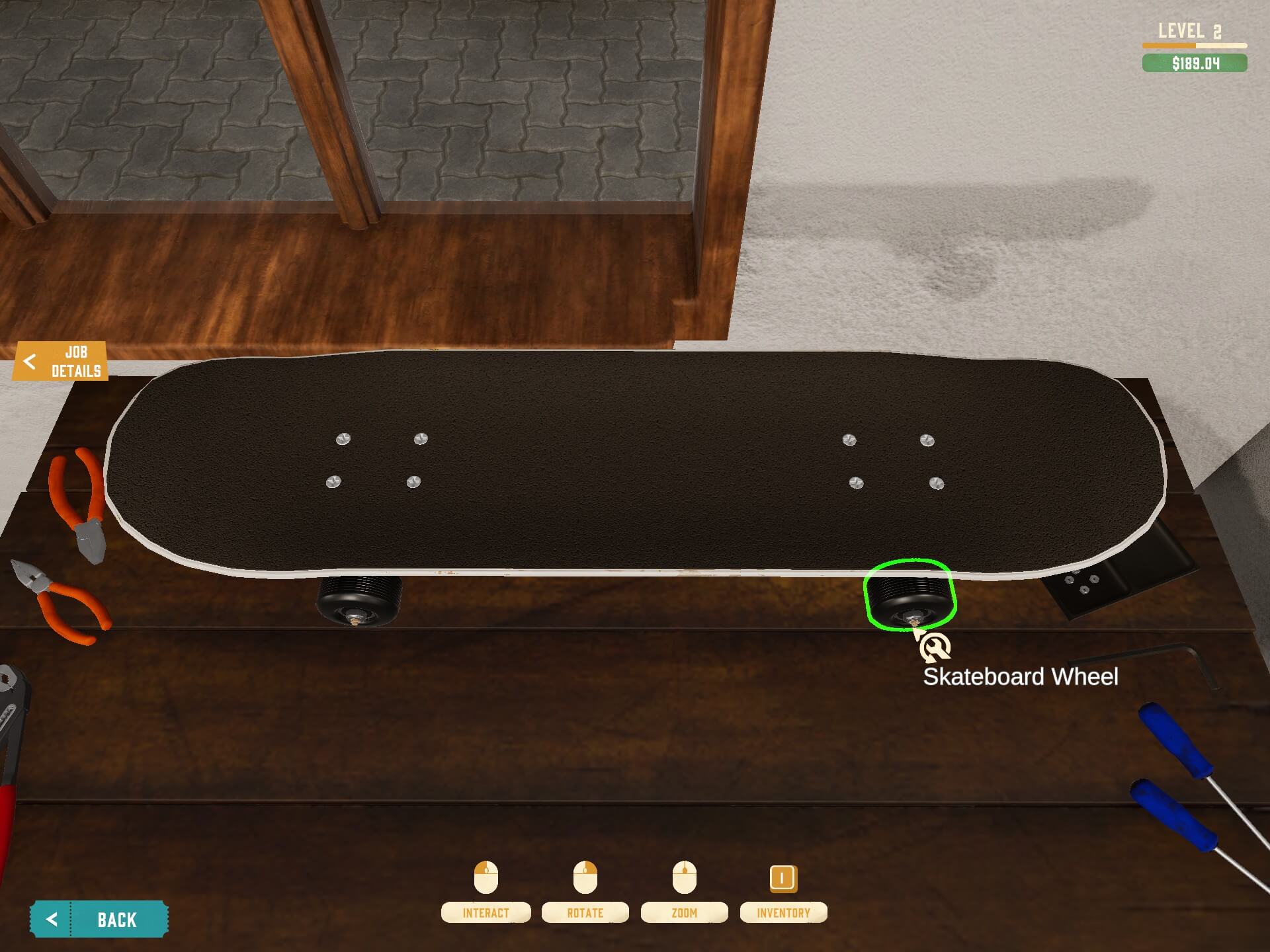 a skateboard on the desk with broken wheels. 