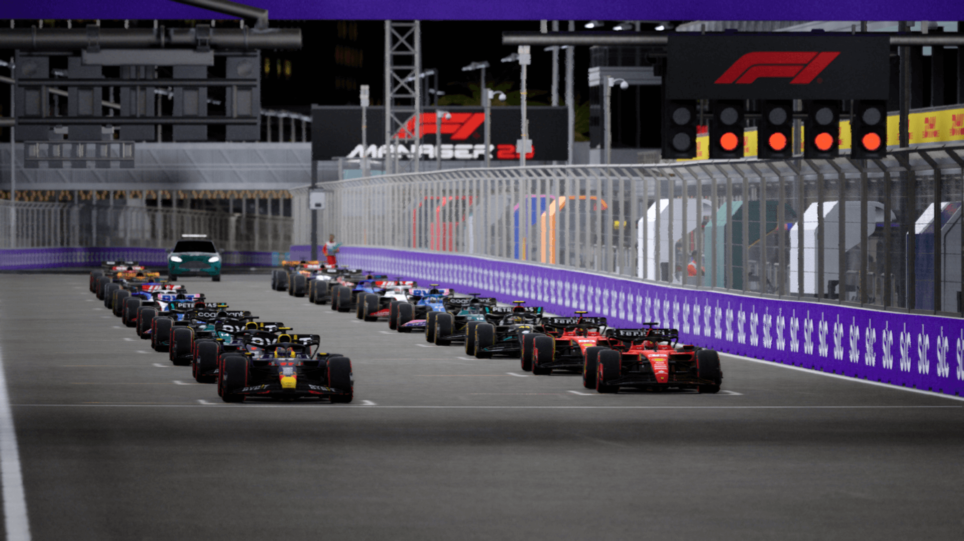 This photograph shows all the drivers ready for lights out positioned on the grid.