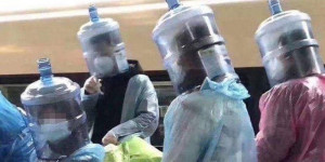 people during the covid pandemic wearing home made protection masks using large water bottles