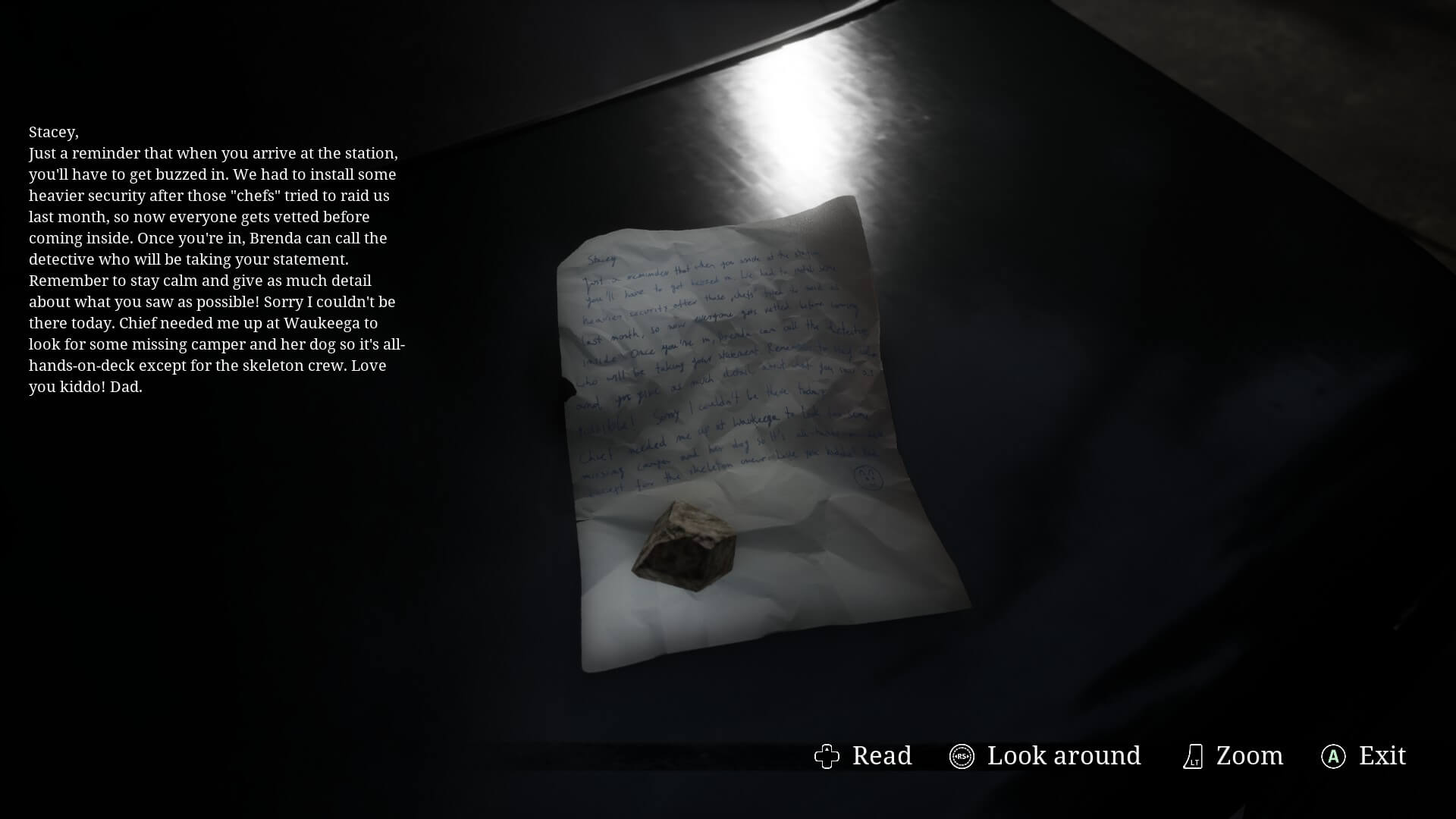 One of the handwritten notes in the game. It's using a small rock as a paperweight. The top left is the note in a better font for the player to read.