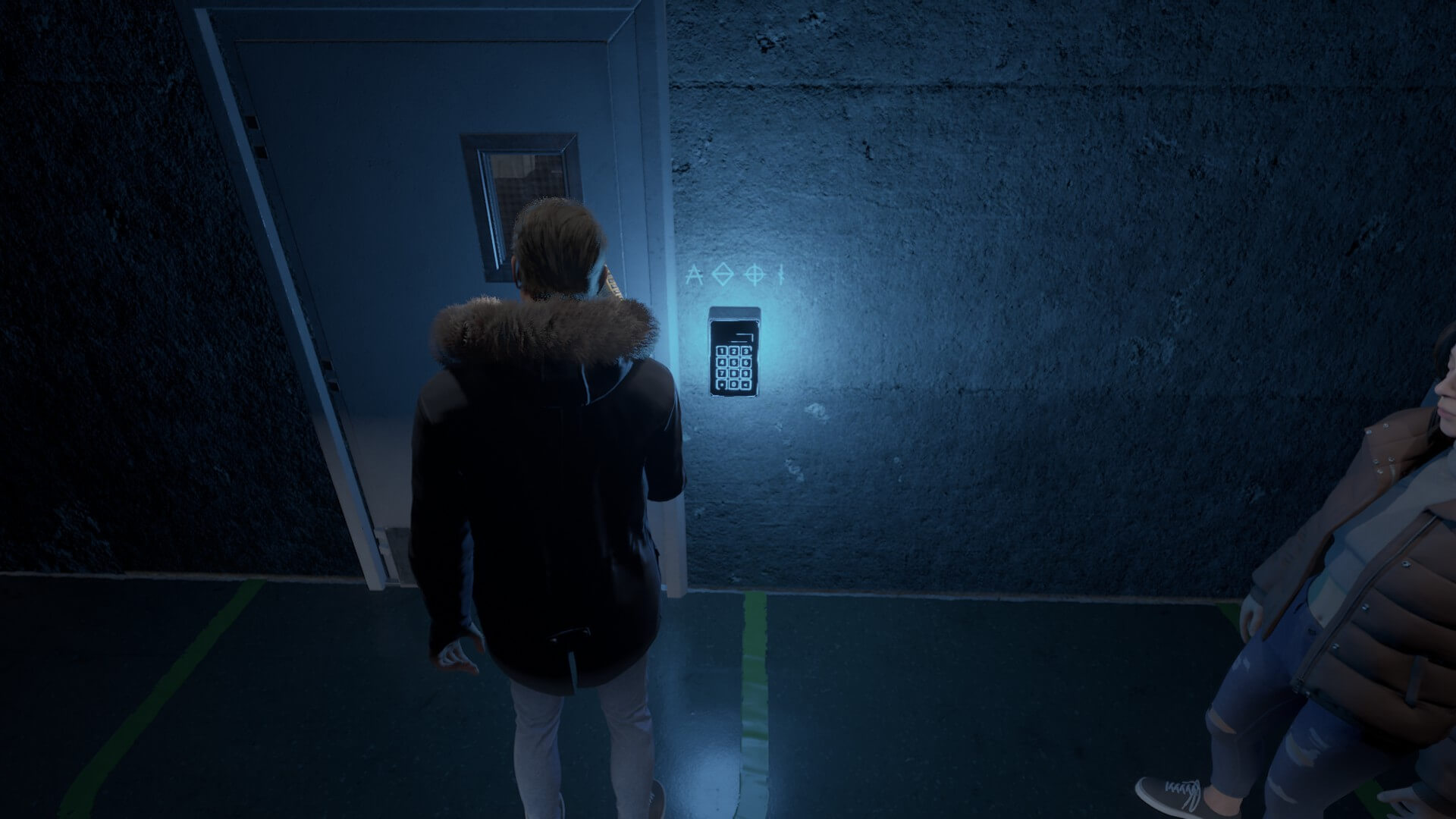 One of the puzzles the player needs to solve is to get through a door. The keypad is brightened by a blue neon light. Martha is stood beside Daniel but her head is just out of site.