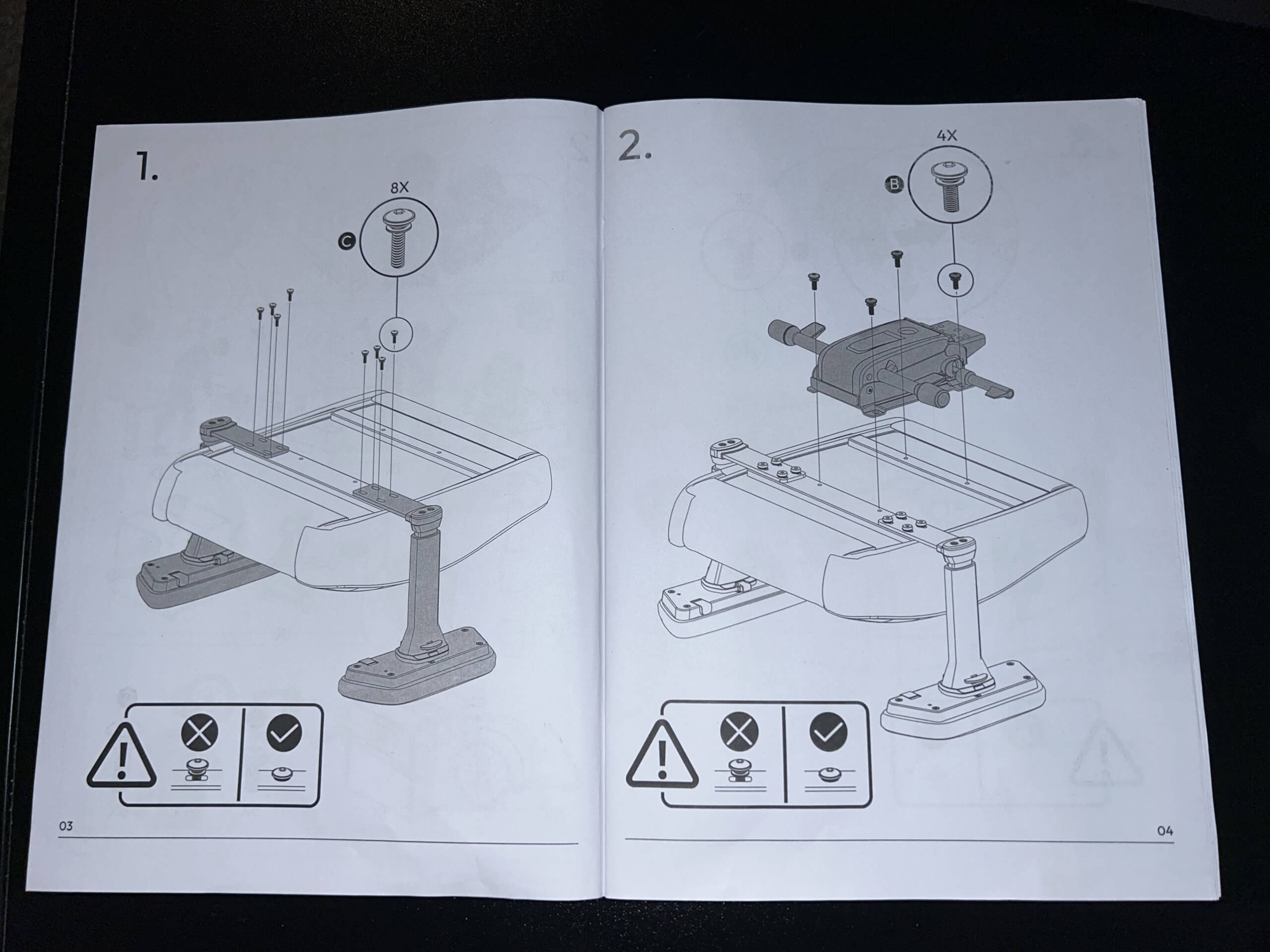 This photograph shows a picture of page 1 and 2 of the instruction manual. It shows two pictures that show the correct position of the screws to add the arm rests, as well as the mechanism under the chair. 