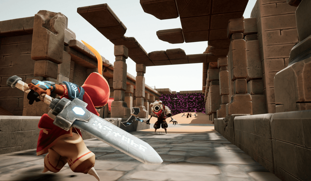 A desert scene in a crumbling temple looking up from floor level. A figure in a red hood carrying a large sword stands in the foreground ready to attack a masked enemy standing further away.