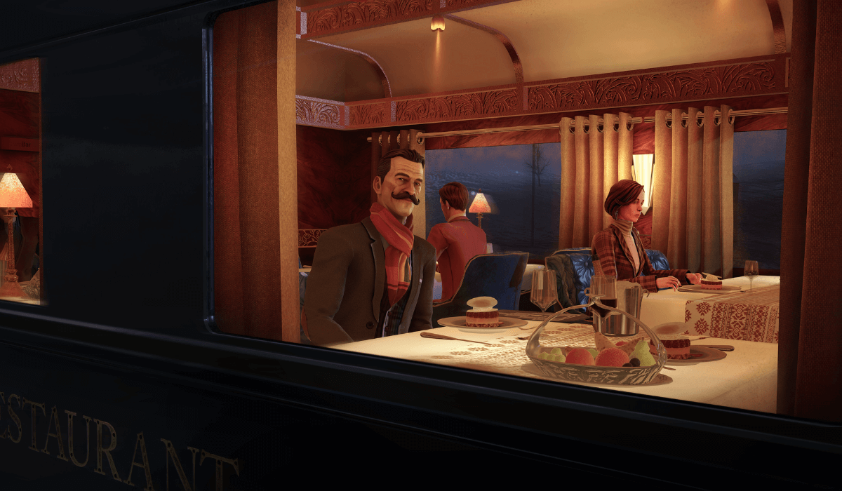A scene of a dining car of the Orient Express train, looking through the window from outside. Hercule Poirot sits at a table looking out while other diners can be seen in the background.