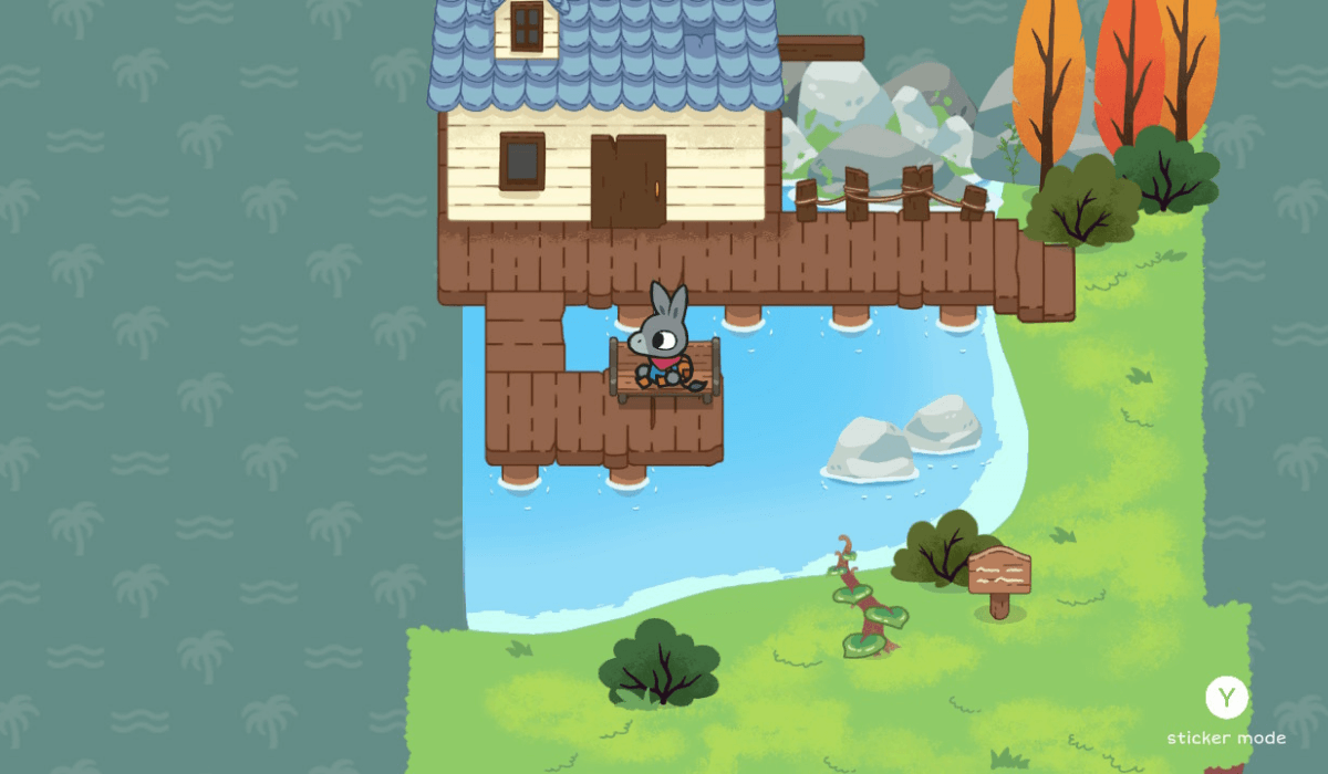 Flynn the Donkey sitting on a bench overlooking a pond. Behind him is a quaint looking cottage on stilts with a dock connecting it to the land beside it.