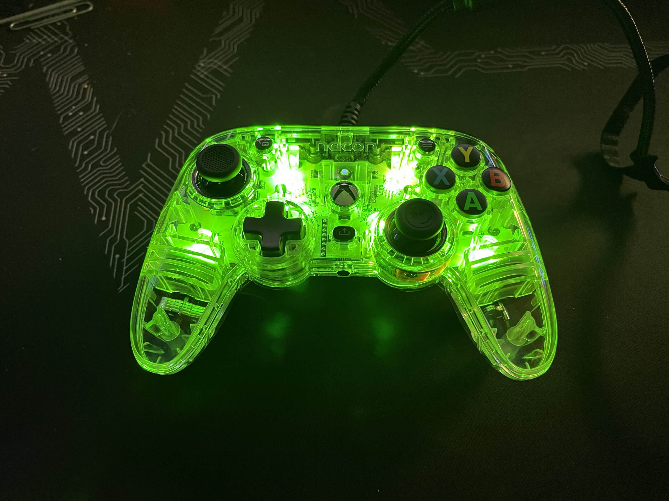 The Nacon Colorlight controller is a clear build with internal diodes that can be set to various colors and patterns. This controller is shown with all the diodes lit green.