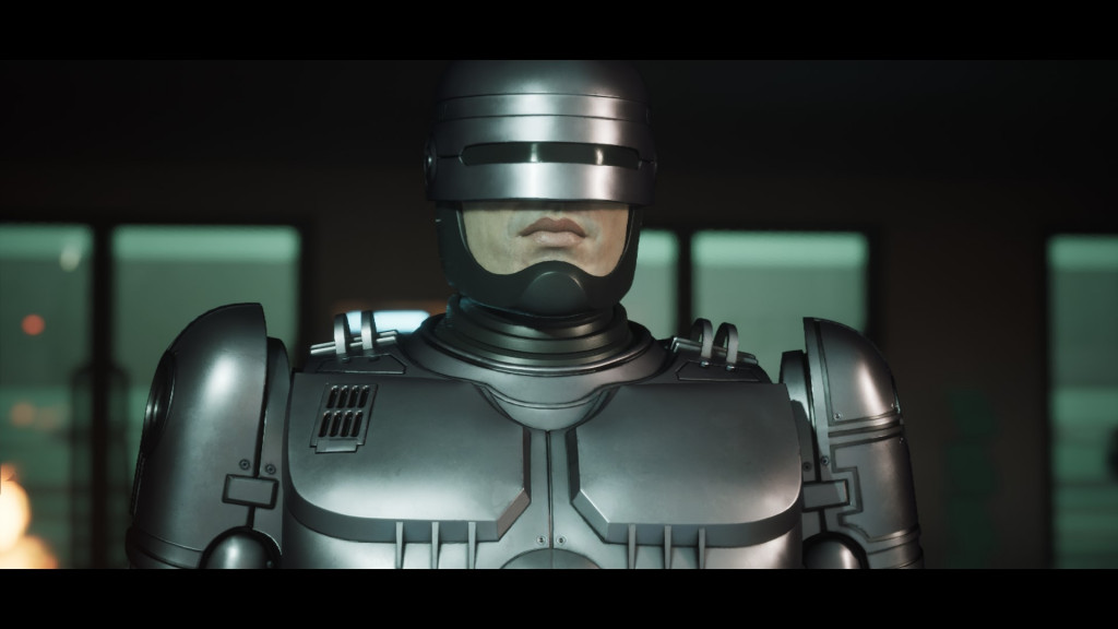 RoboCop stand centre screen looking past the camera.