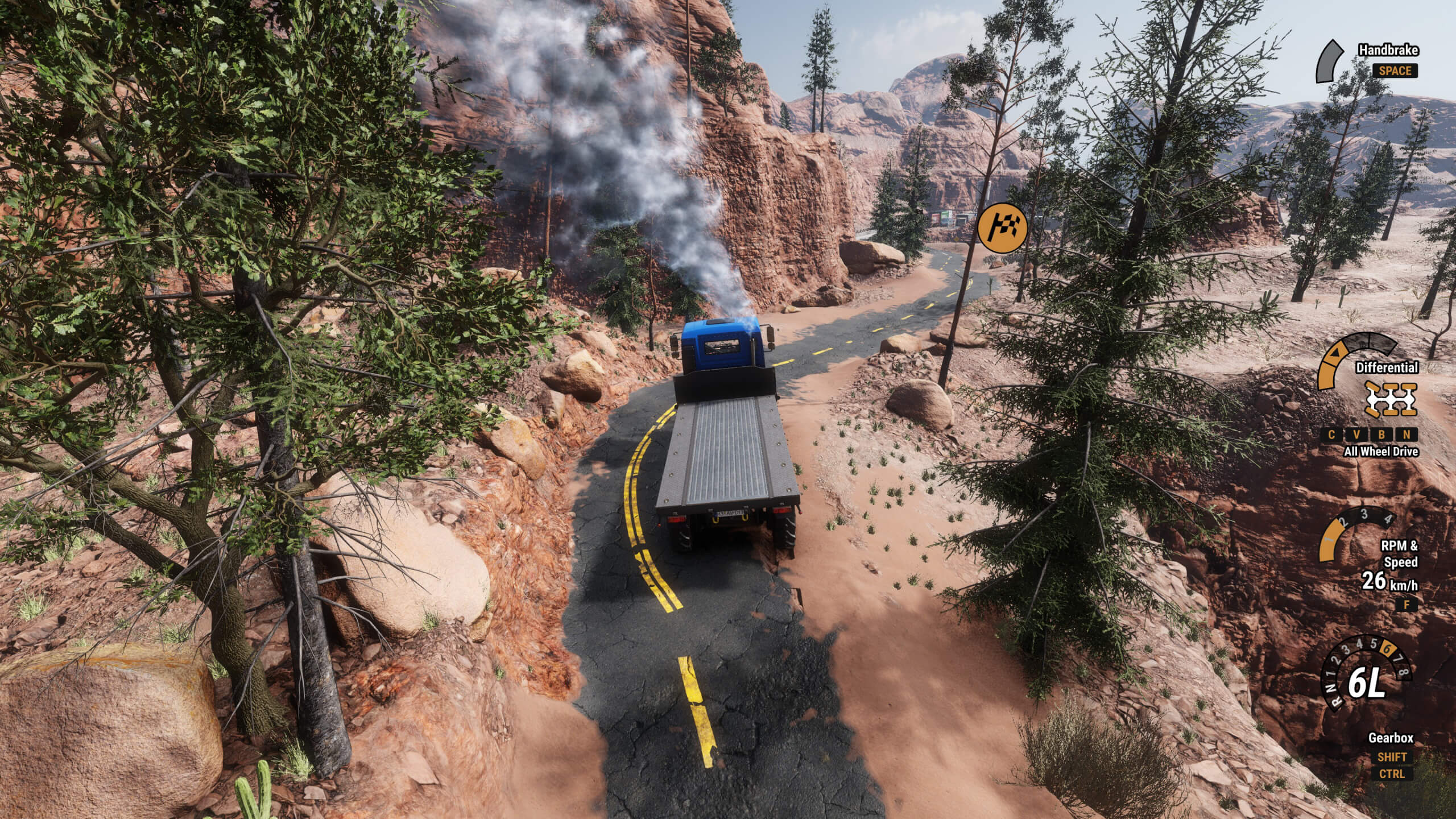 A flatbed cargo truck drives down a very unevenly paved road in a rocky area with trees lining the edge of the clearing.