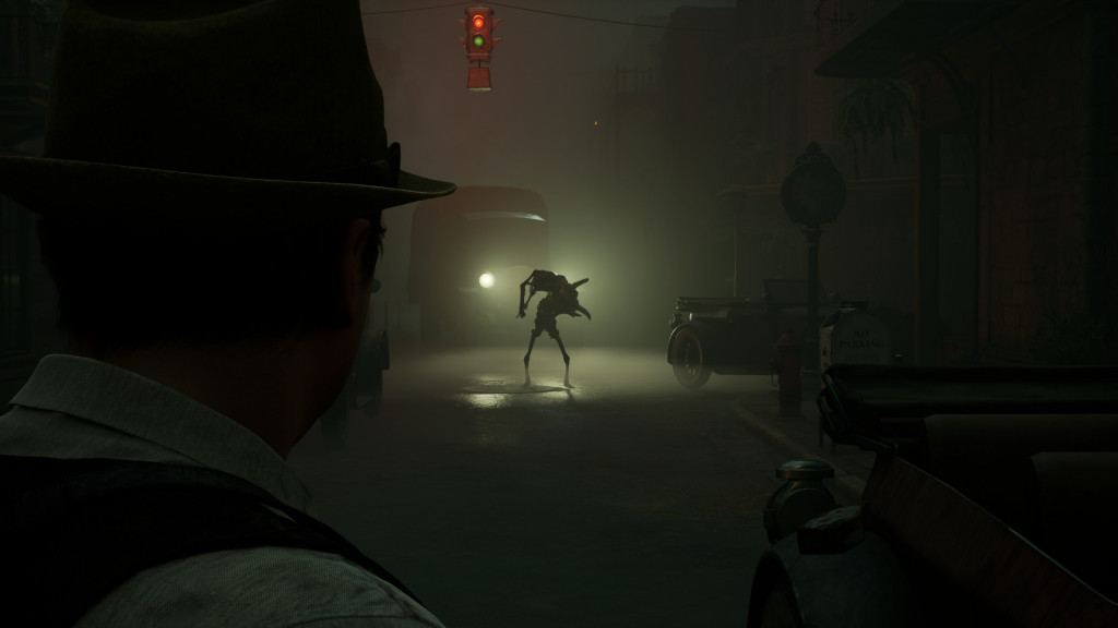 screenshot showing Edward facing a monster in a street that is lit by lorry headlights behind them. 