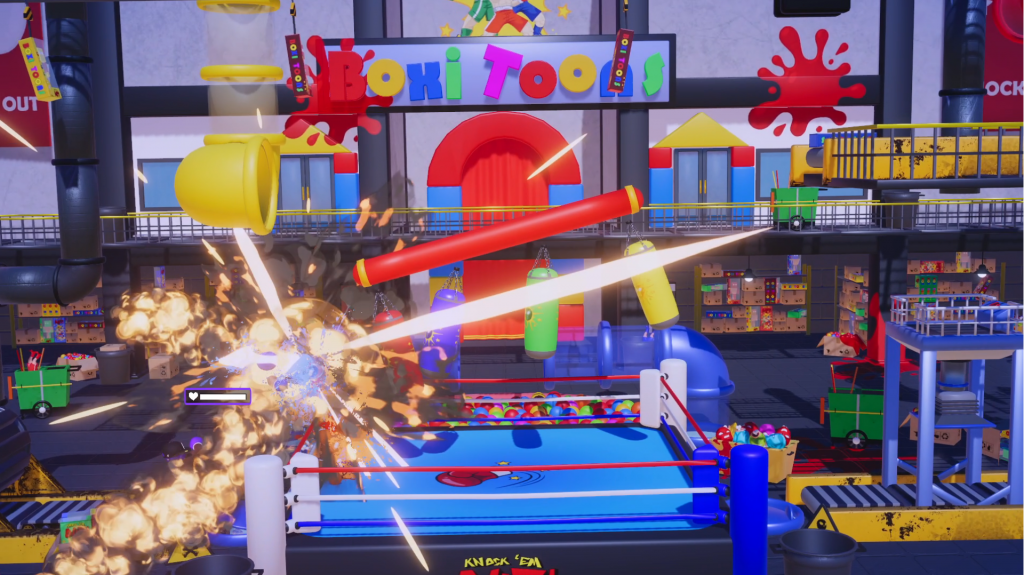 An explosion features to the side of a wrestling ring with vibrant fun house furnishings around it.