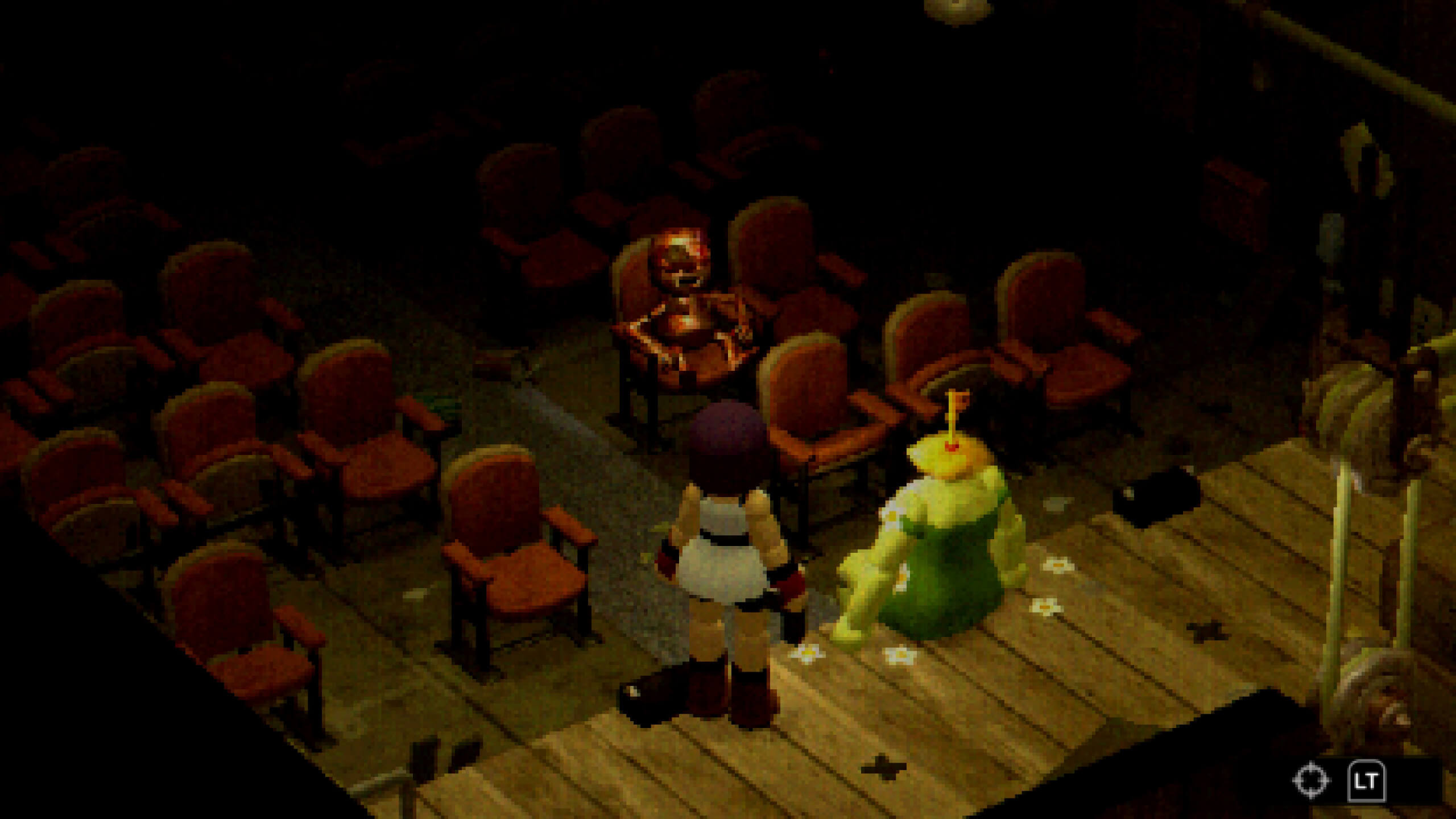 I am standing in a theatre hall next to a animatronic with a key spouting out of its head. You can see a creature sat in the crow, is it dead, I don't know.