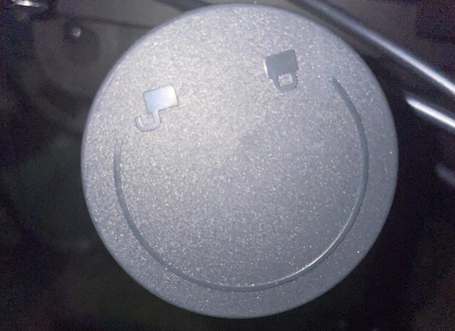 A component of the chair shaped like a smily face