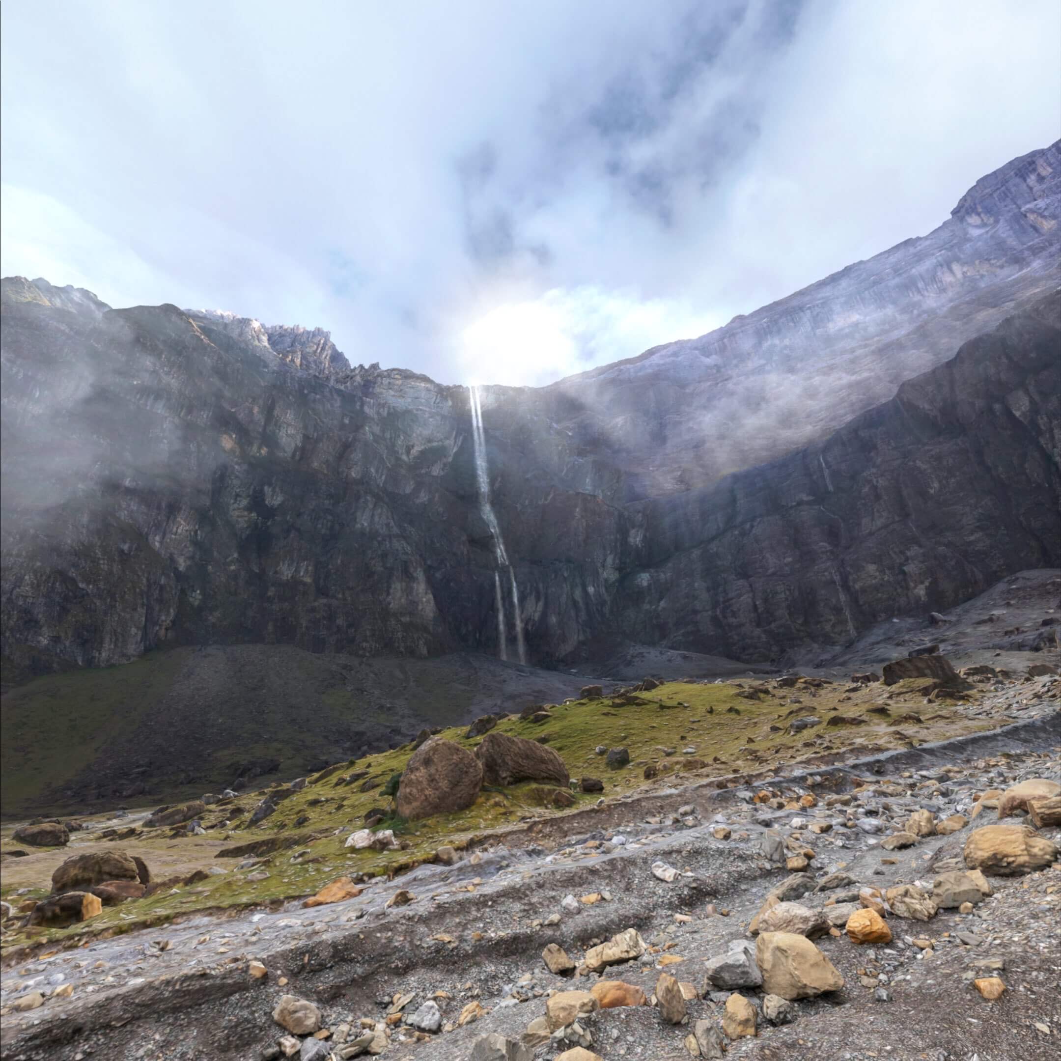 Screenshot from Brink Traveler. A slender waterfall cascading down a rocky mountain cliff under a hazy, sunlit sky.