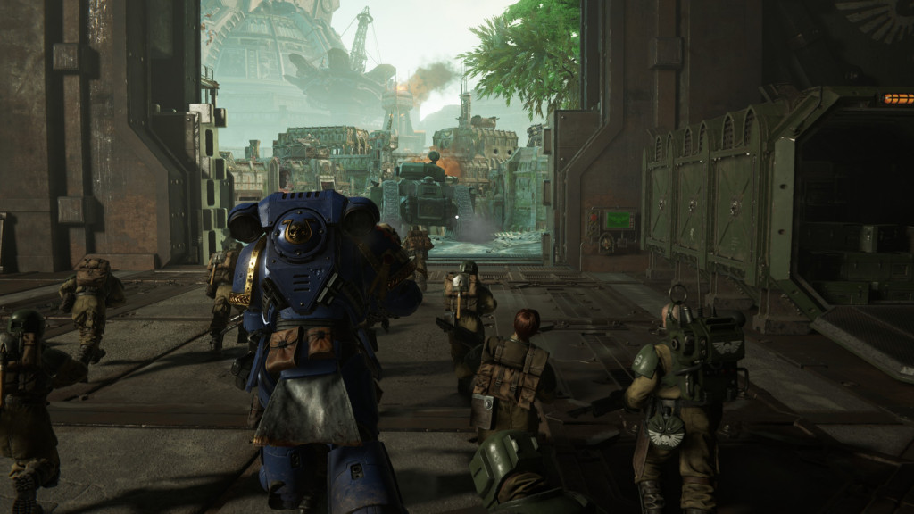 Soldiers and a mech in a futuristic, industrial environment preparing for action.
