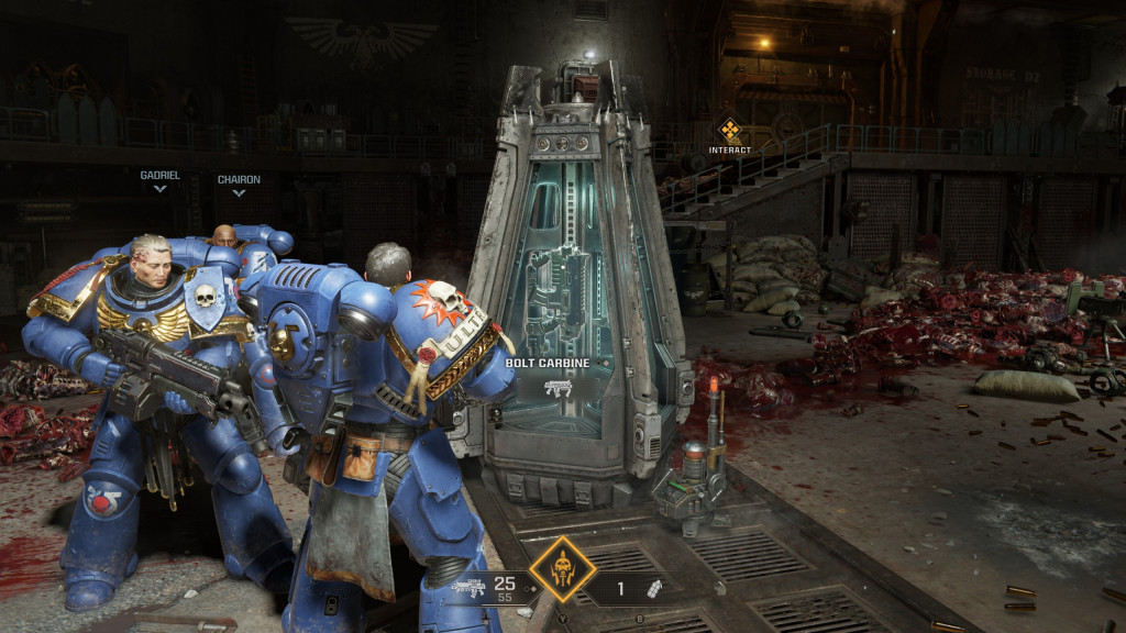 Armor-clad characters in a game interact with a weapon station, amid a background of gore.