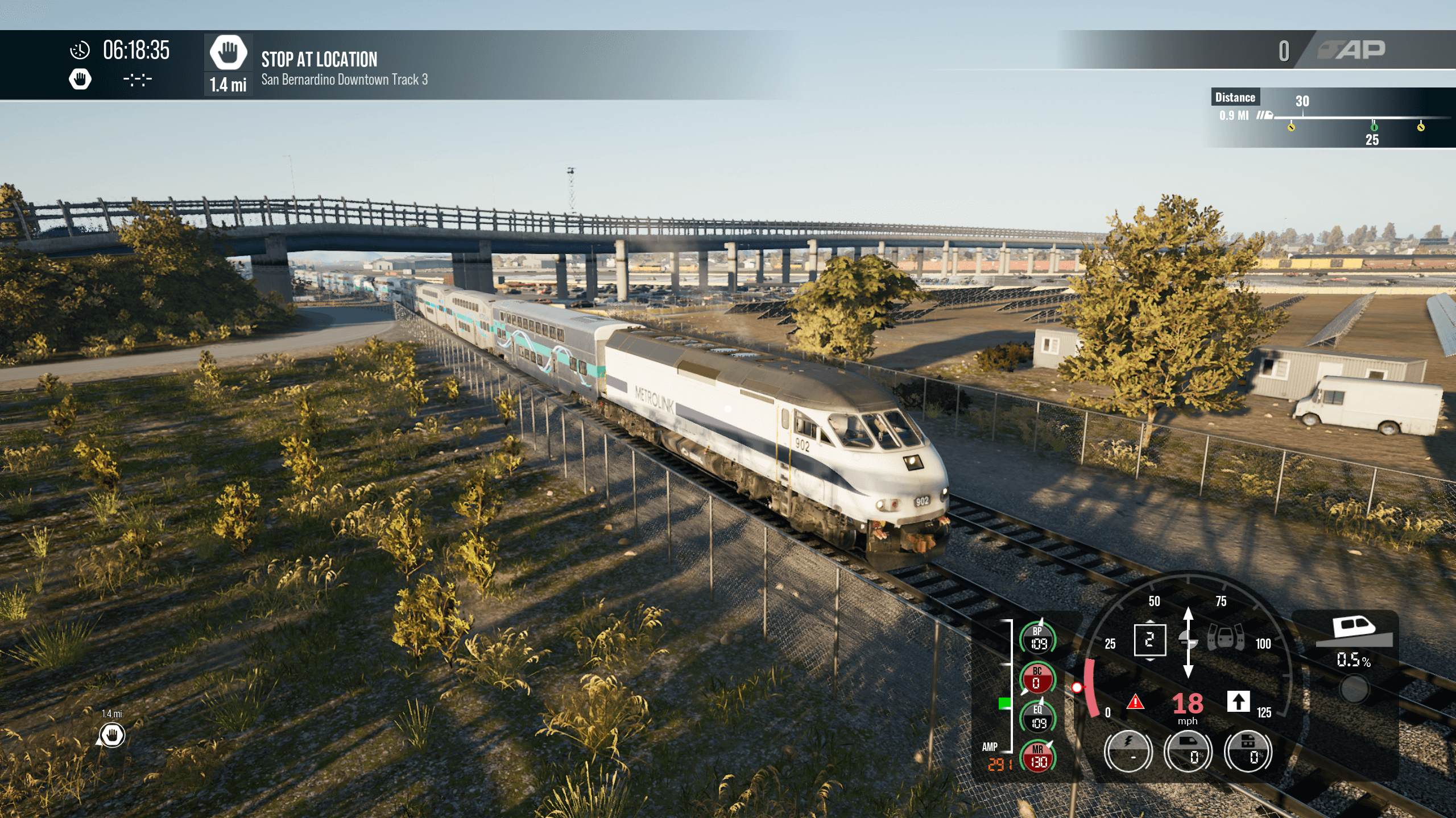 screenshot from train sim world 5 showing a train heading under a bridge, with trees and bushes around