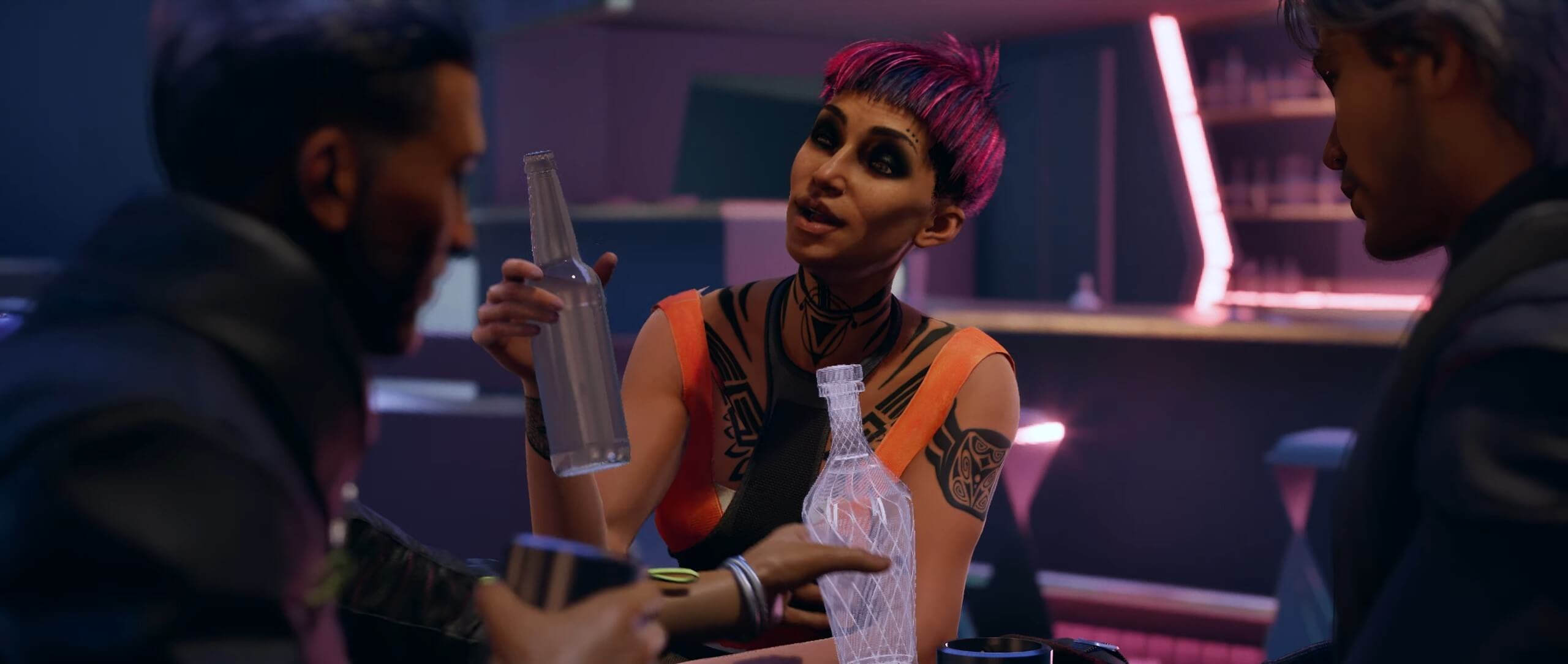3 characters sit around a table. Image is focused on a tattooed, feminine character with a short pink and black hairstyle. She's wearing a orange and black strappy top. Also at the table are 2 masculine characters. The trio appear to be socialising over drinks.