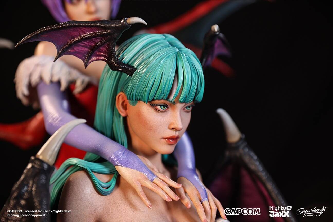 A close-up of a collectible figure featuring vibrant teal hair and intricate details on the character's arms and wings.