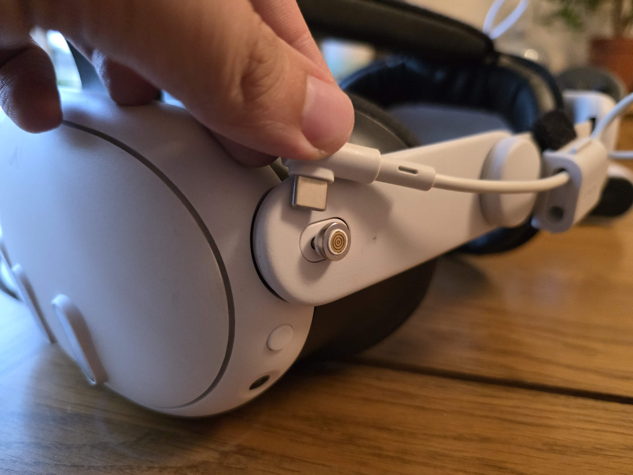 If you use the provided adaptor, you can't plug in an external battery pack