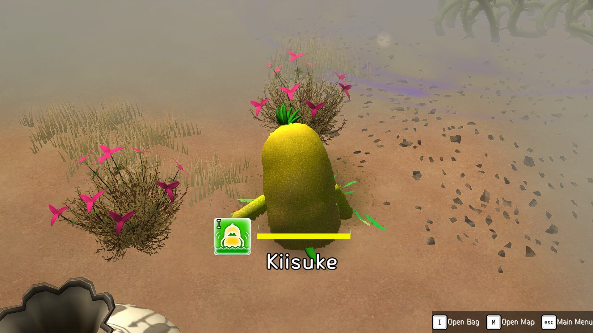 A cute, yellow, potato-like character named Kiisuke stands among pink flowers in a foggy, sandy environment.