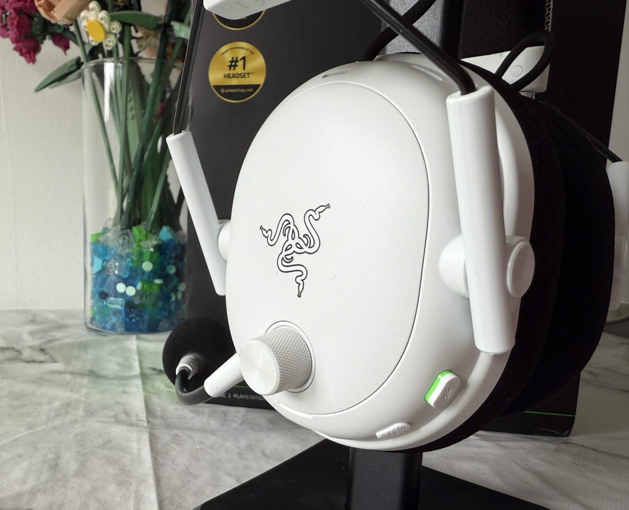 image of the blackshark v3 pro headset on a stand showing a few of the buttons on the headset