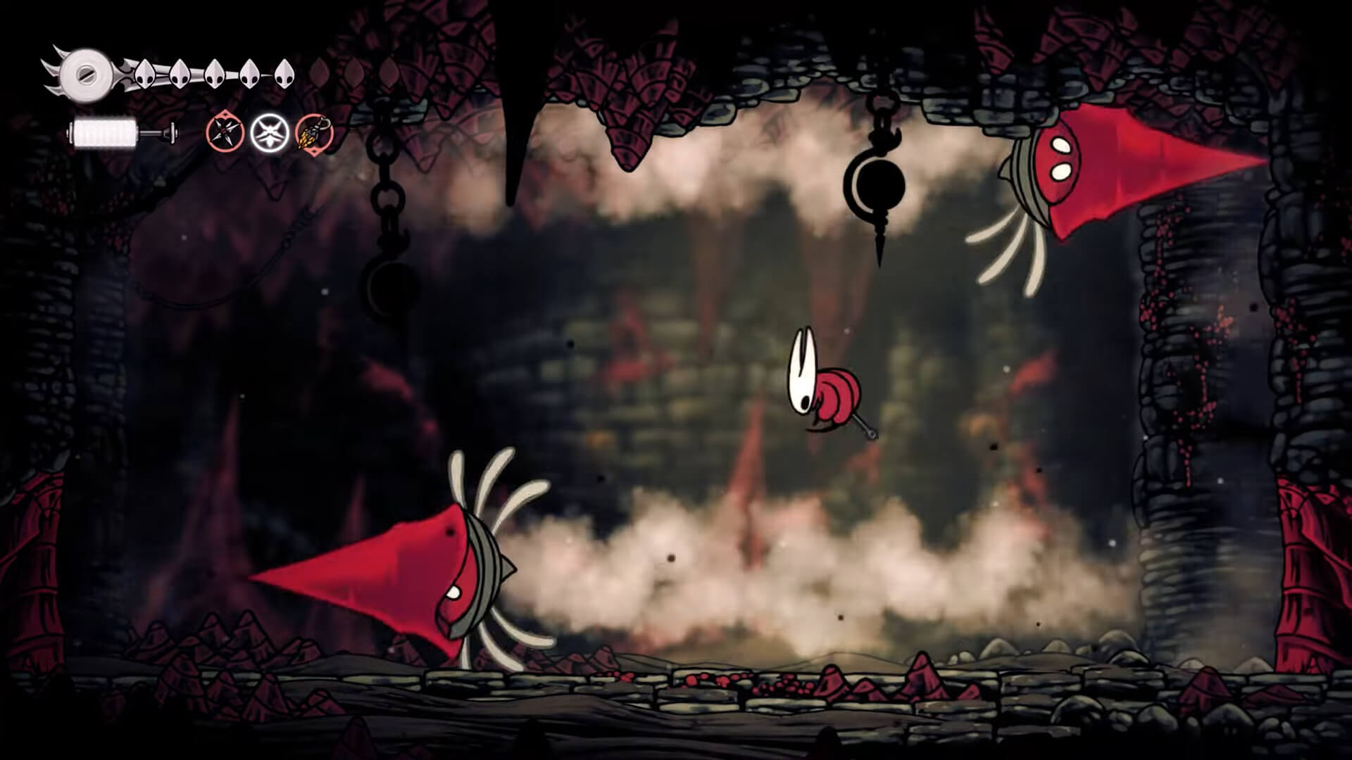 Screenshot from Hollow Knight: Silksong. Hornet in battle with 2 enemies that resemble drills. They have large, red, conical shells on their head that they are using to attack as they cross the room and to drill into the walls.