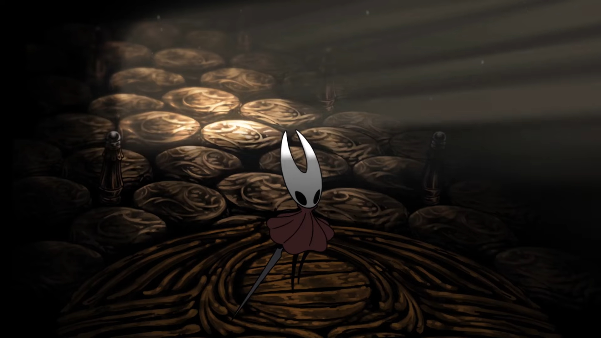 Screenshot from Hollow Knight: Silksong. Main character hornet stands on a gilded path, facing a large door that is gradually bathing her in a golden light as it opens. 