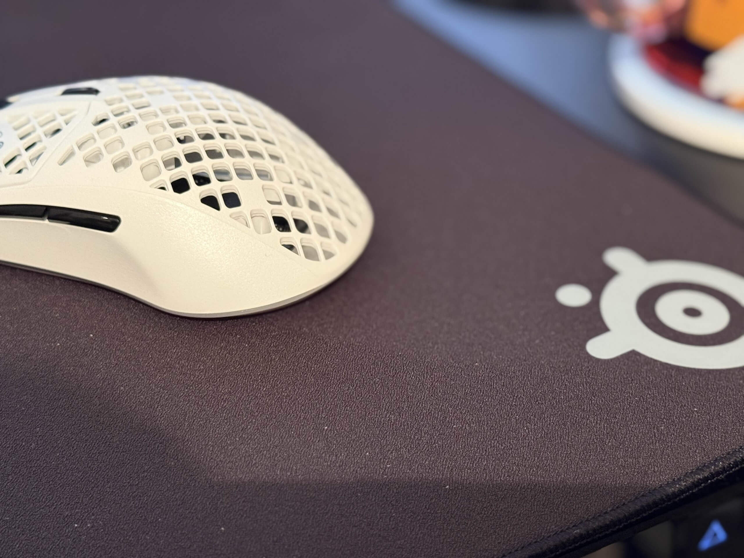 image of a steelseries mouse on the QCK Performance control mousepad