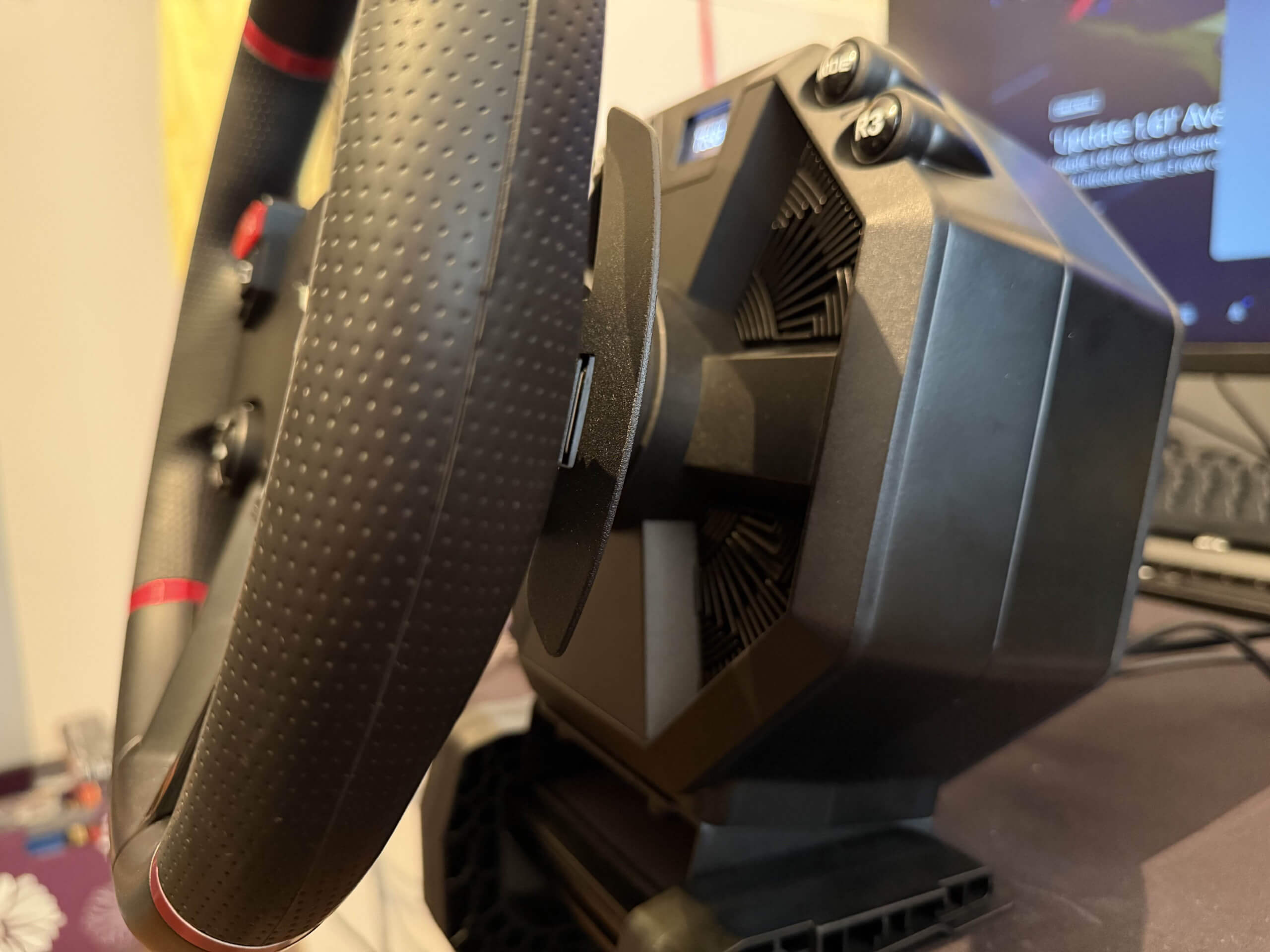 Thrustmaster T598 side on view showing the whole unit connected to a desk