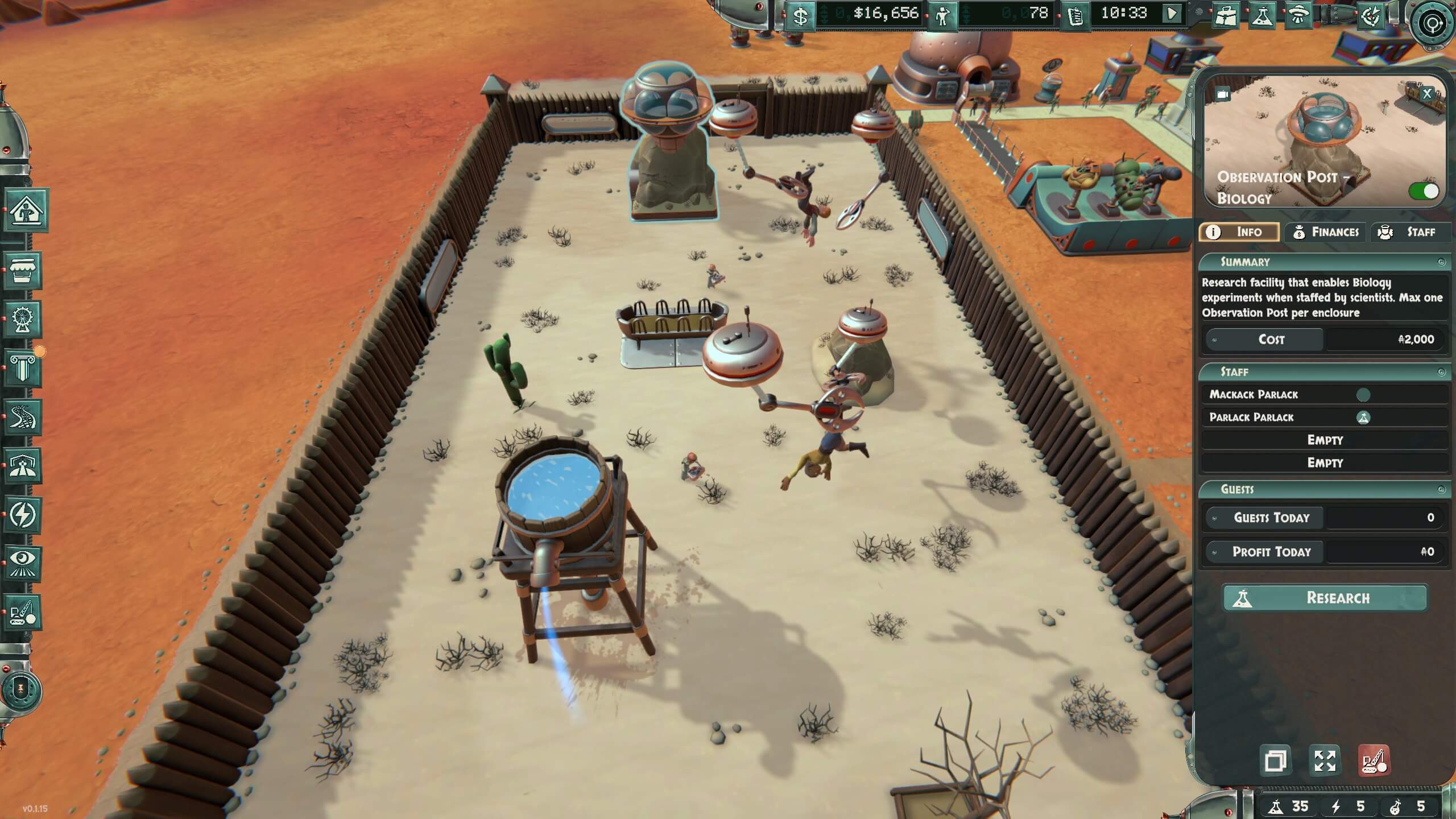 A sandy, enclosed research area with various scientific equipment and biological observation pods, showcasing a futuristic setting.
