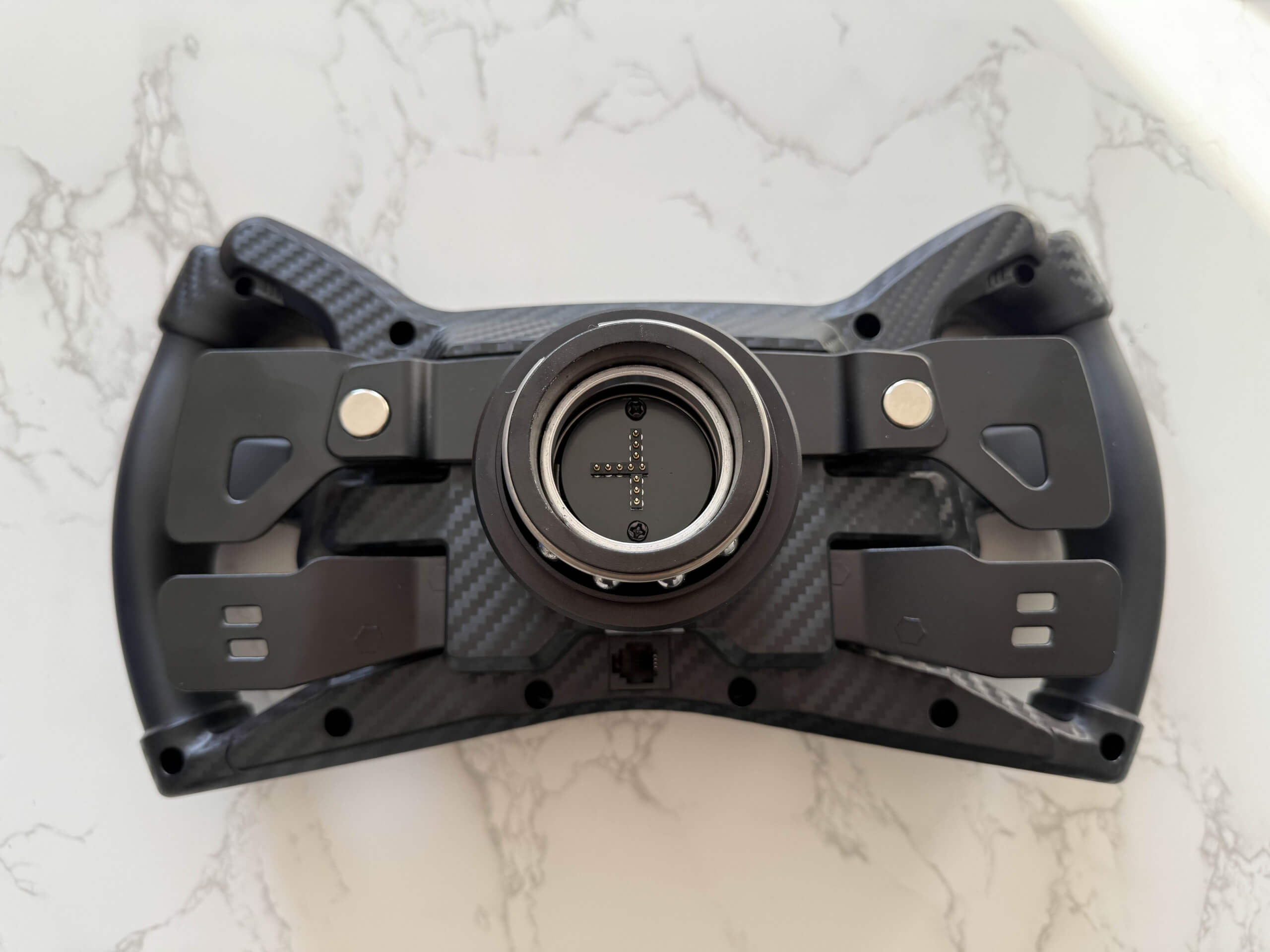 moza racing ks steering wheel from the back showing off the rear of the steering wheel