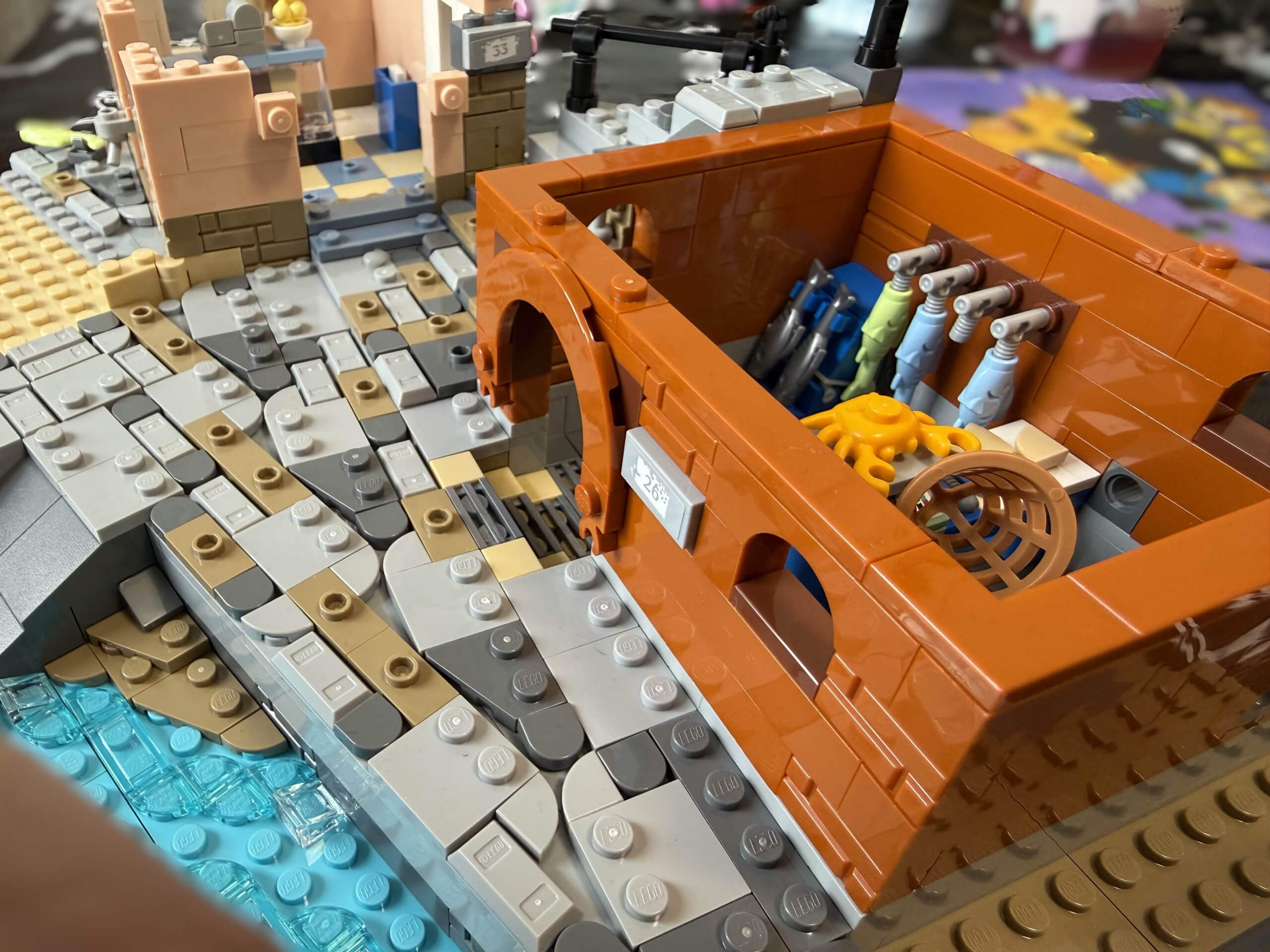 Close up top down view of first building first floor and lake of the LEGO Italian Riviera set.