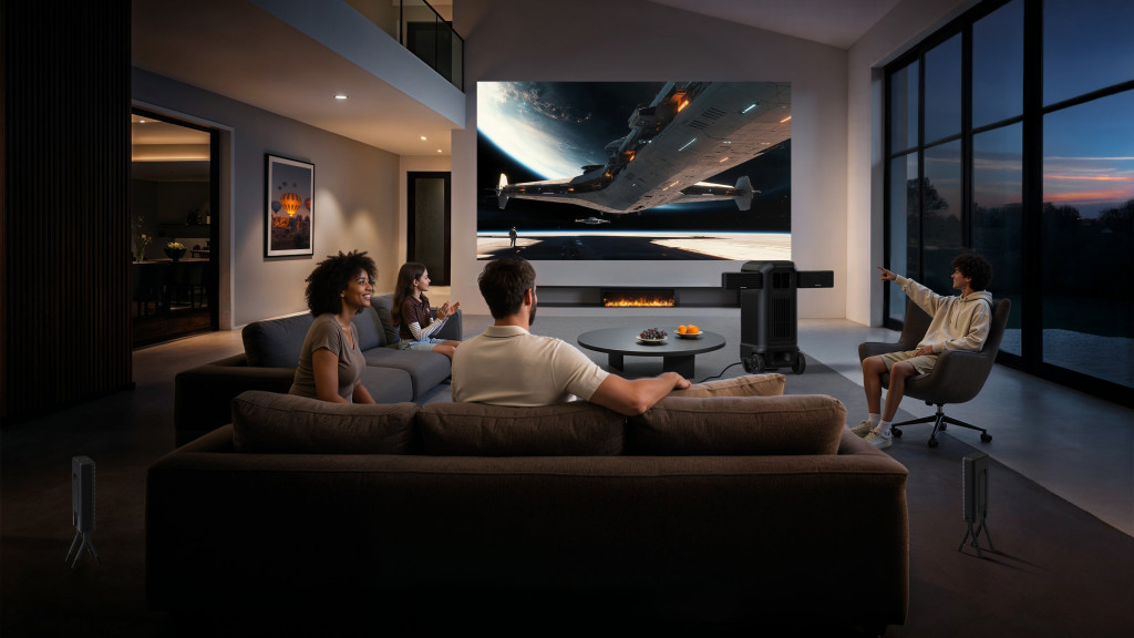 A group of four people relaxes in a modern living room, watching a space scene on a large screen. The setting is cozy and high-tech, conveying enjoyment.