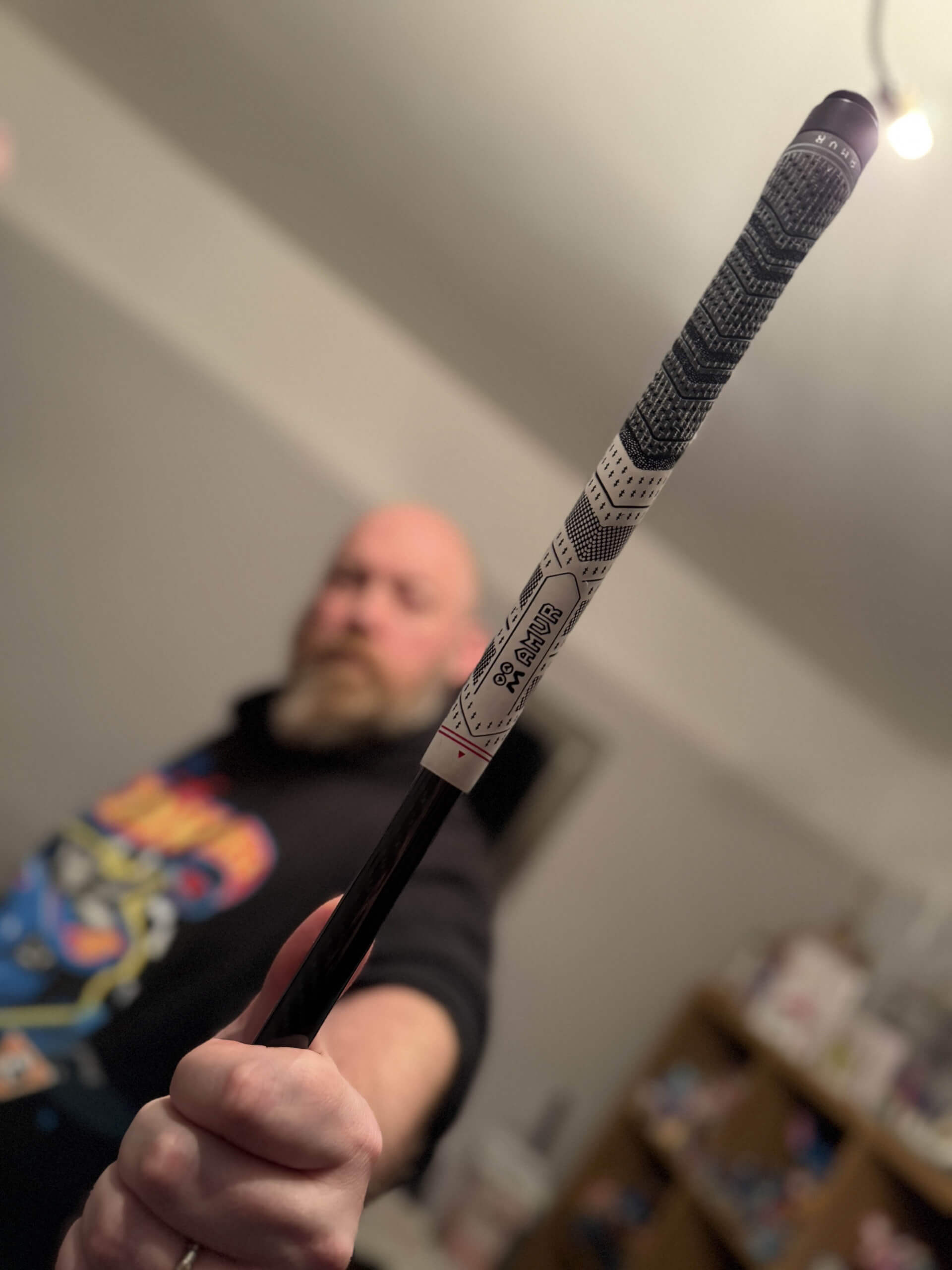 image showing me holding the AMVR GA1 Golf club with the AMVR logo on the grip