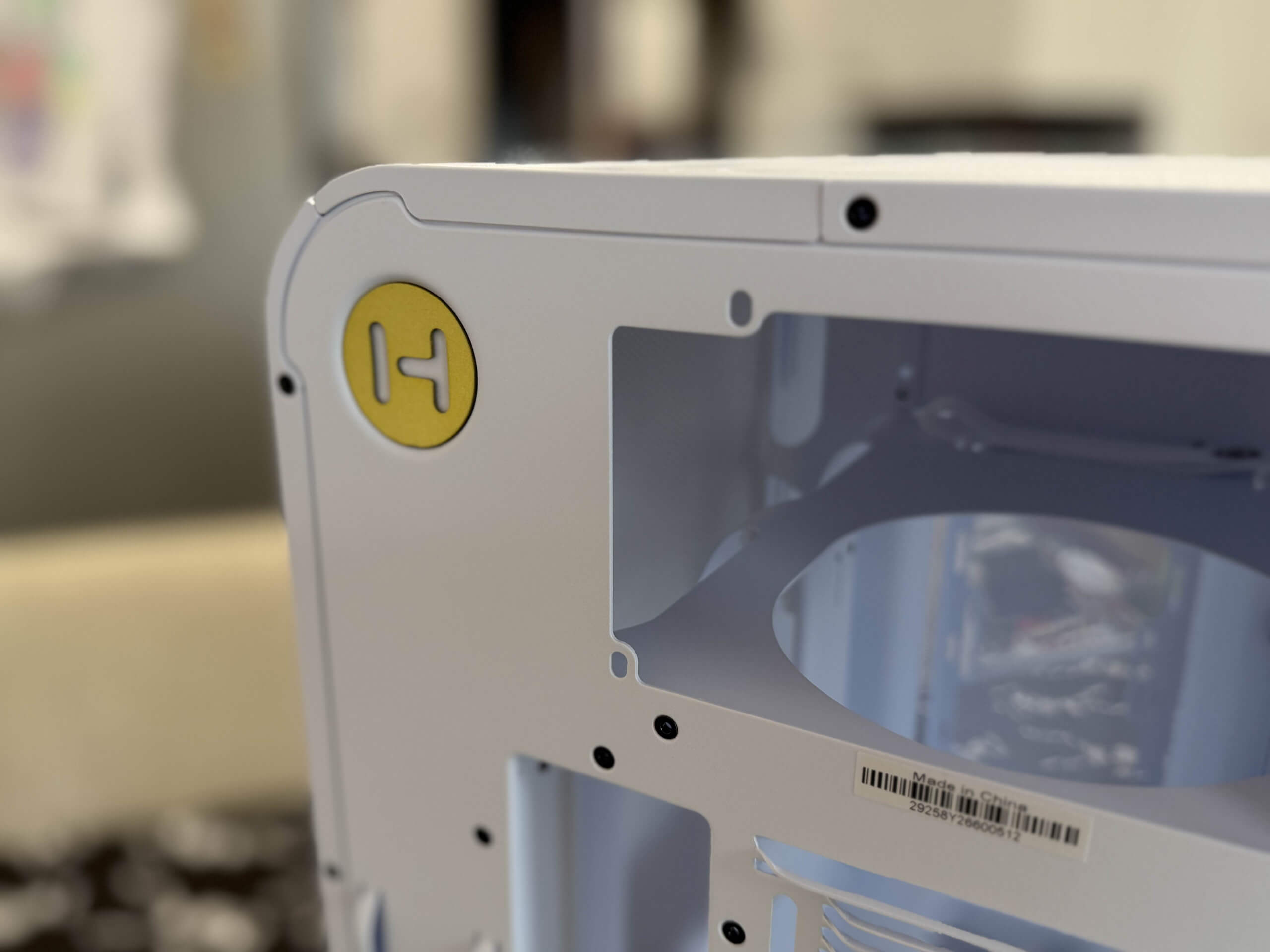 image of the hyte x50 air case showing off the branding on the rear by the psu slot