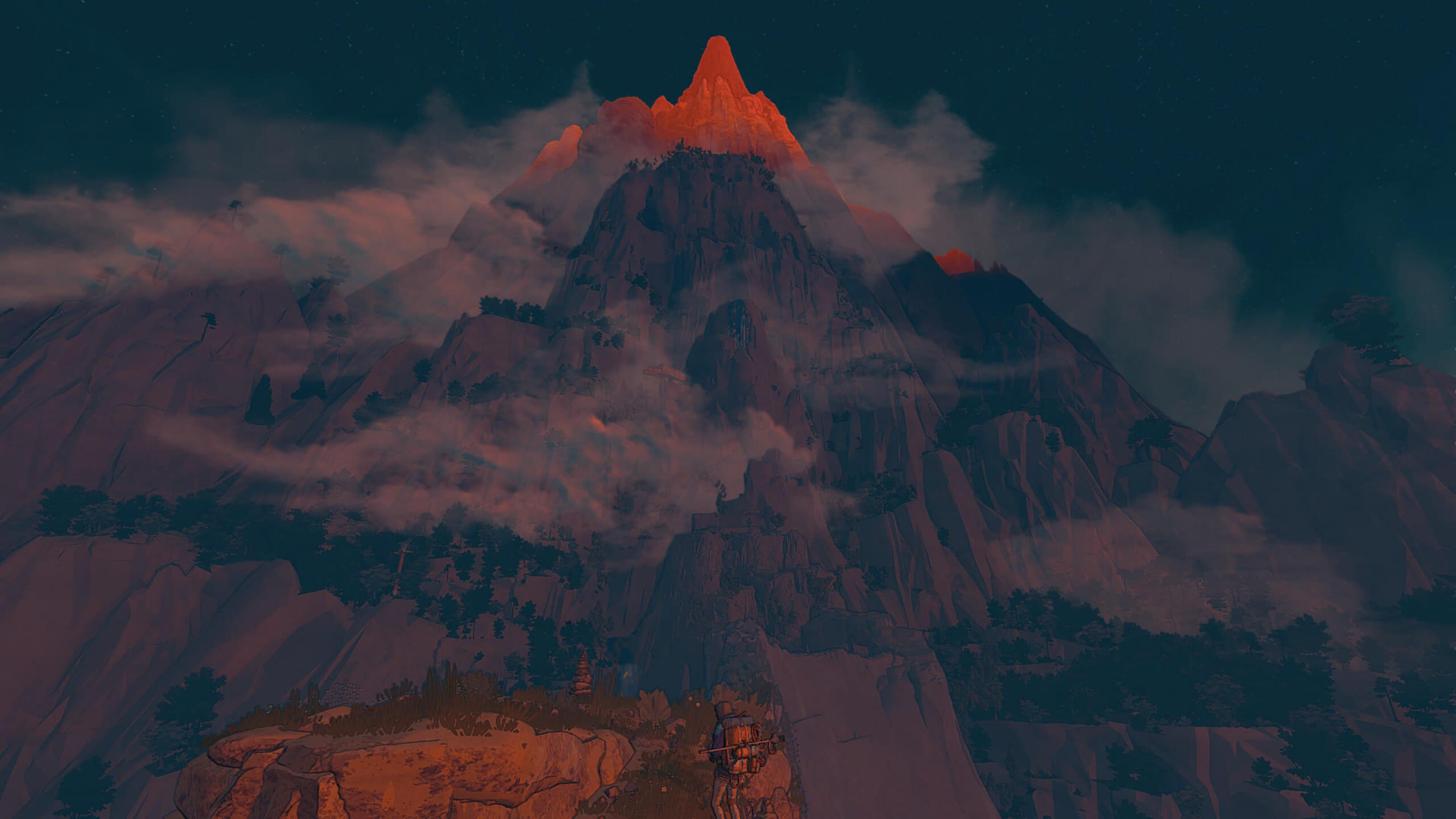 Screenshot from Cairn. Aava looks tiny in the foreground of the image, with the entirety of a huge mountain sprawling out in front of her.