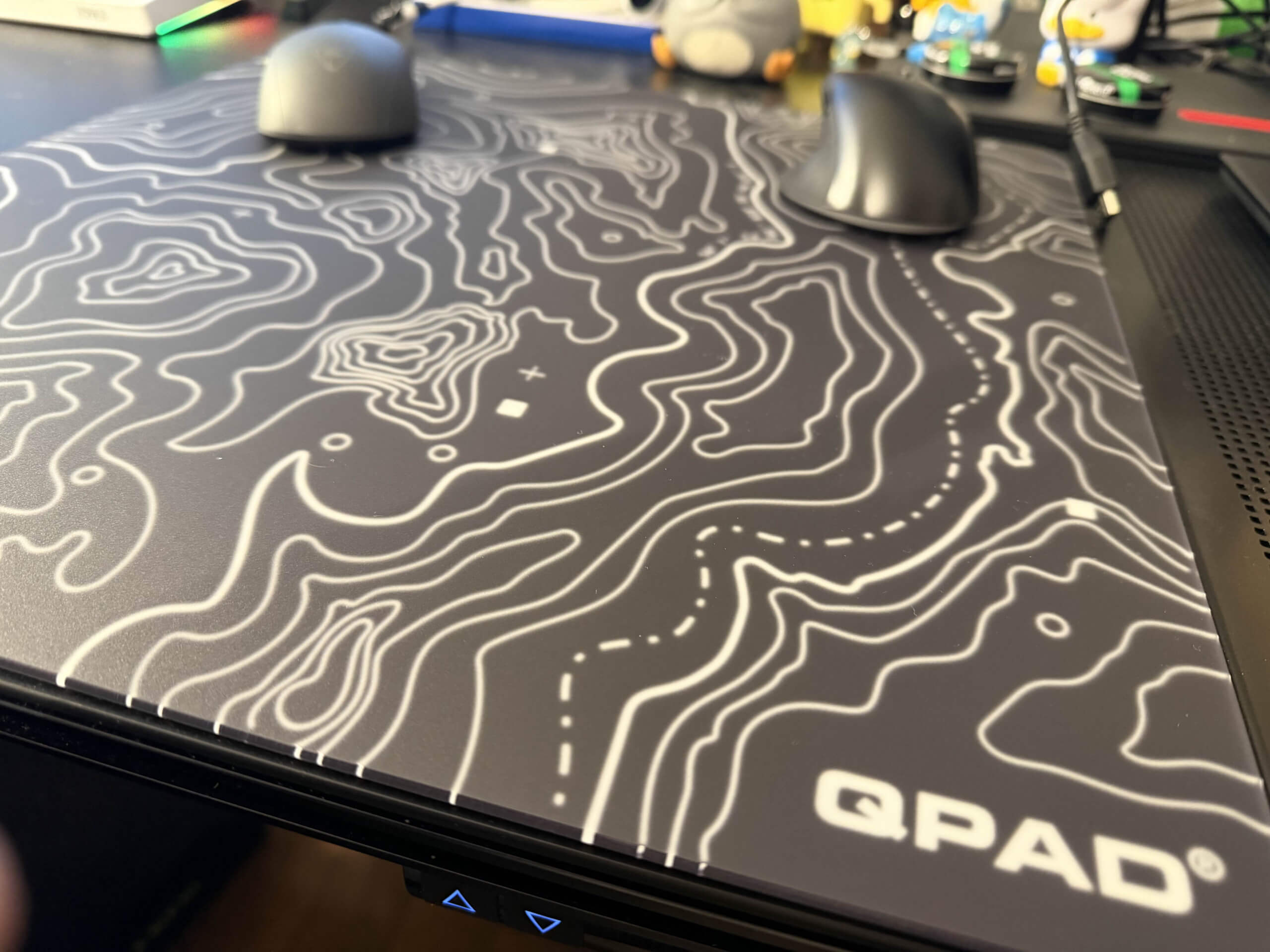 image of the obsidian mousepad on the desk with its contoured design