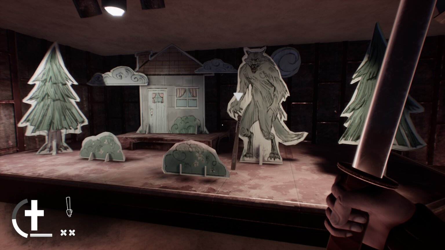 Several cutouts on a stage, most are trees, while one is a house. And lastly and most noticeably is a tall werewolf.