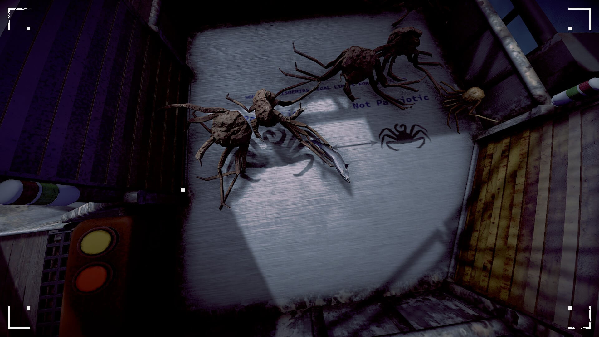 Five crabs in a tray called the hopper. Four of them are medium size while one is small. A fishing is also seen in the shot. To the left are two buttons one yellow the other red.