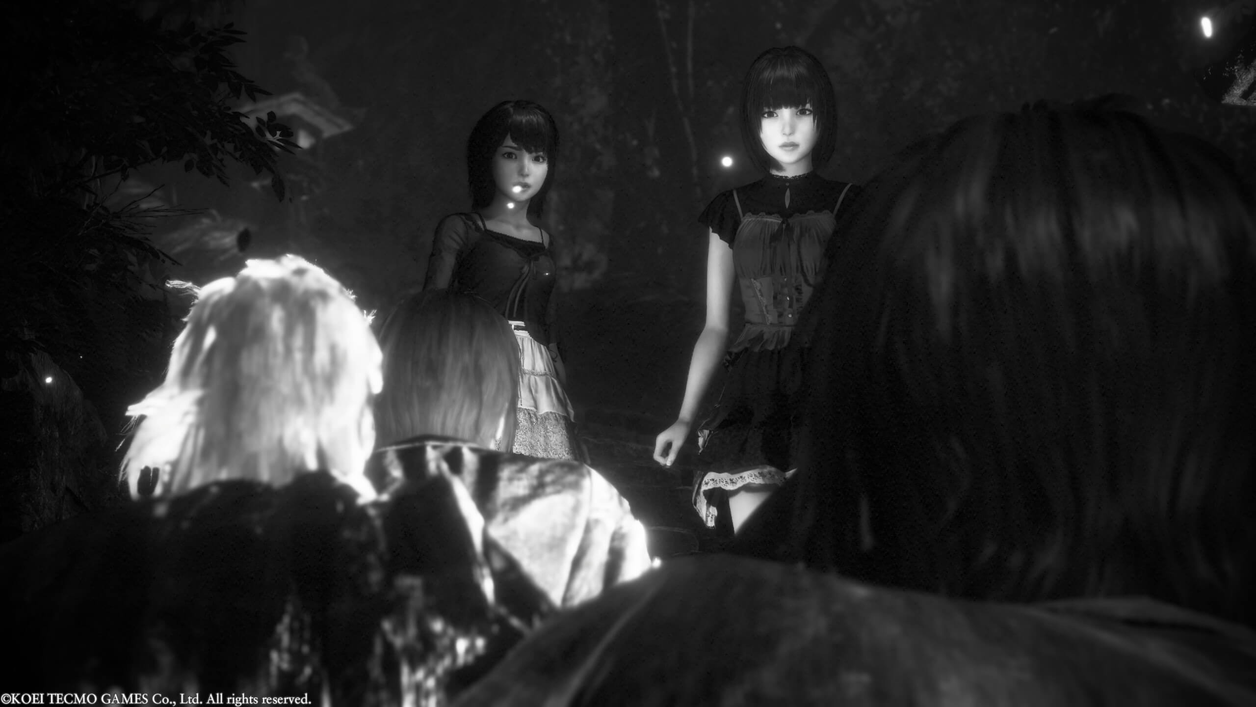 Two young girls, looking towards an oncoming group of villagers. One of the villagers seems to have black hair. 